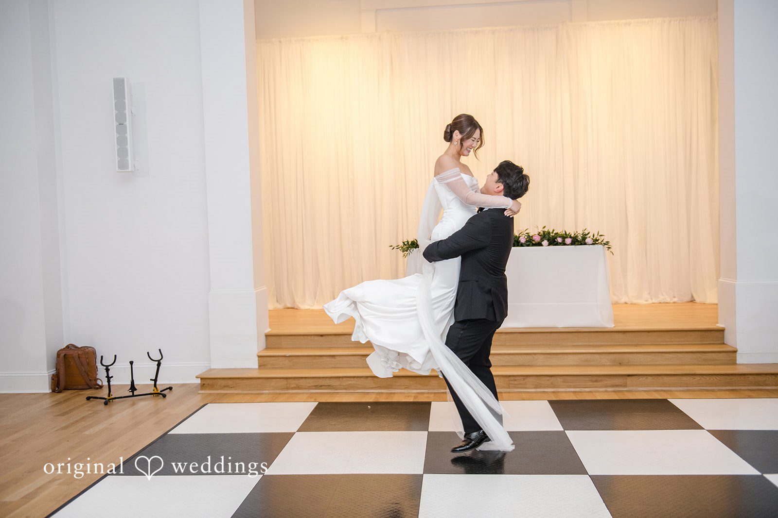 Yuri + Zachary Groom lifting the bride on the dance floor