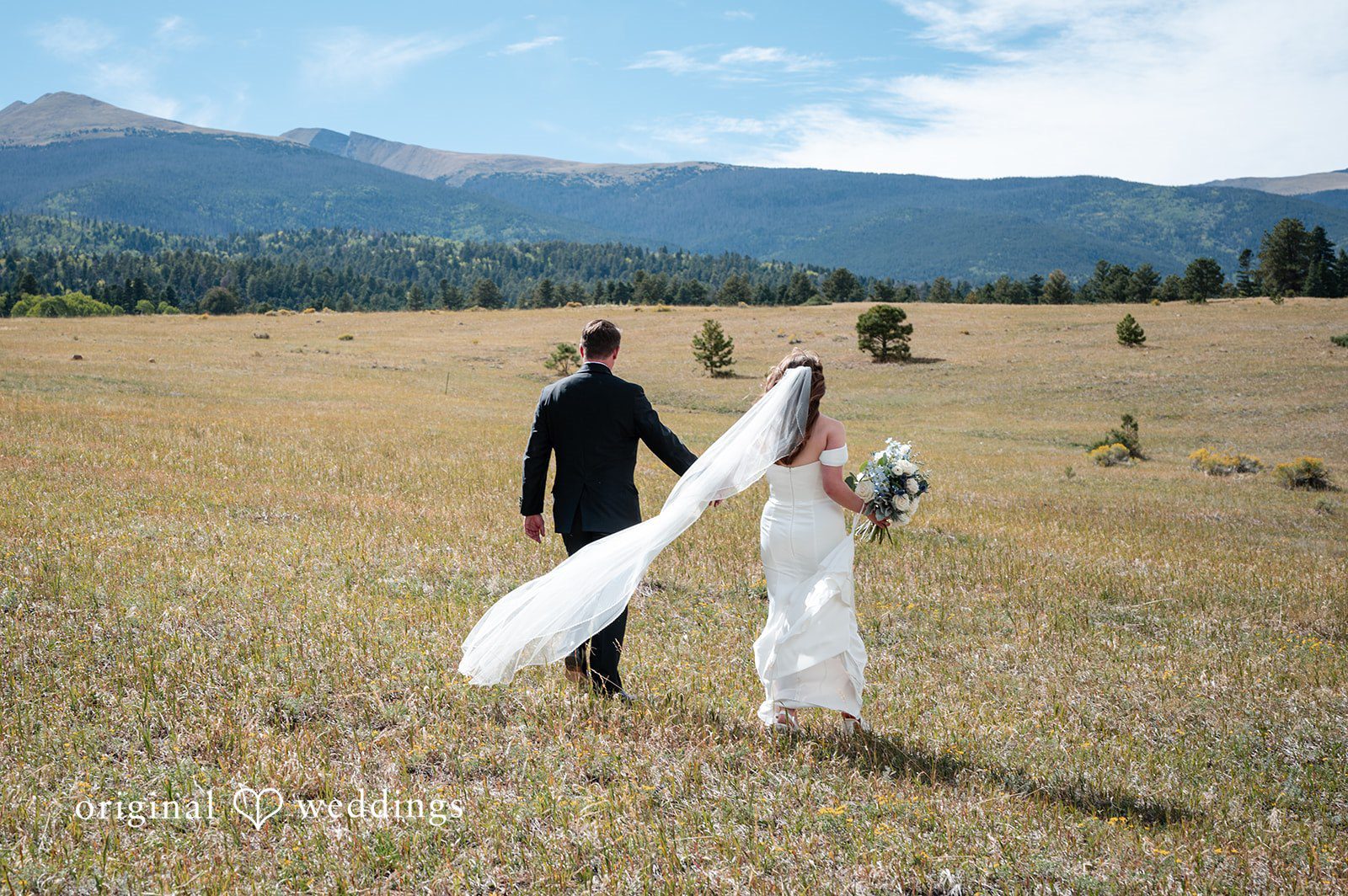 Erin + John Groom spinning the bride in the field