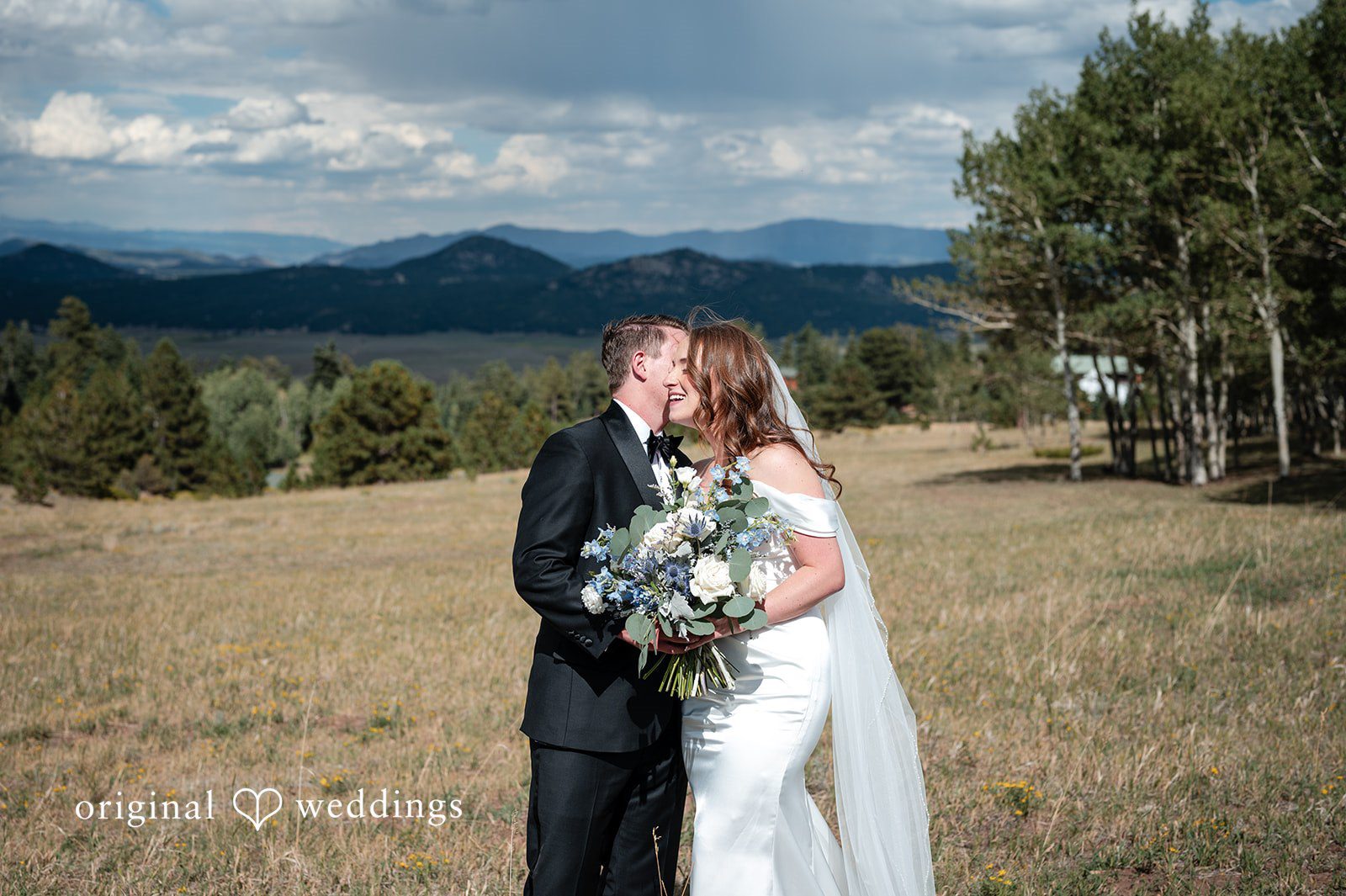 Erin + John Wide mountain view with the bride and groom