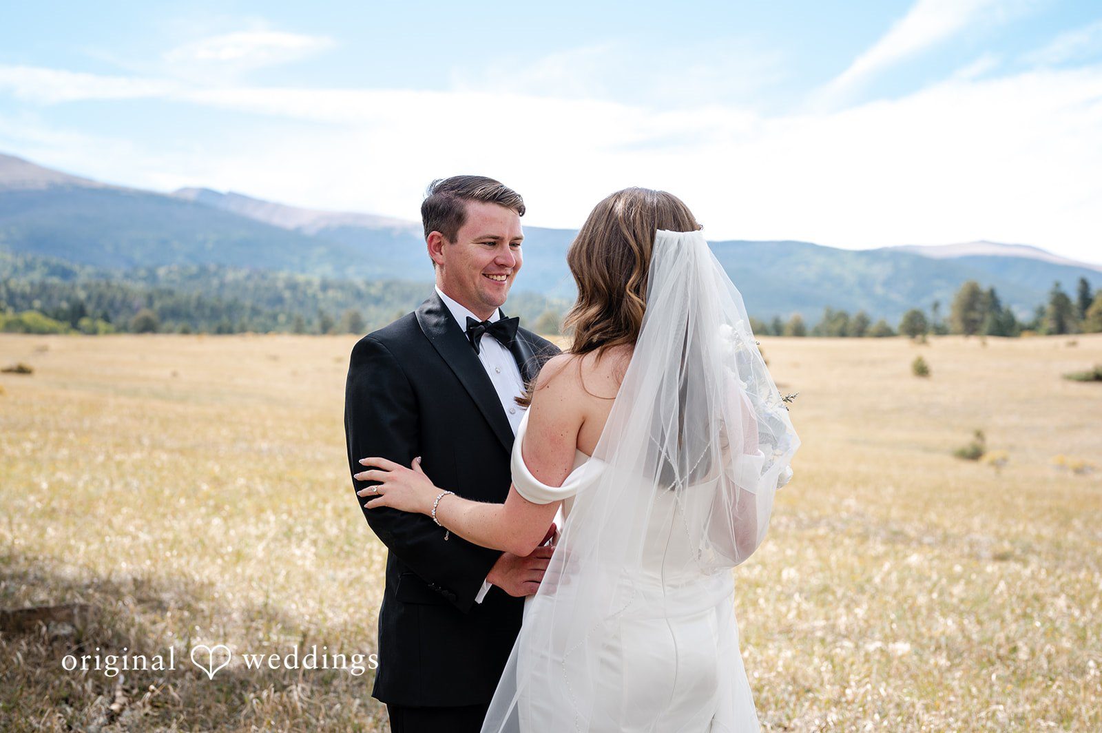 Erin + John Bride and groom walking through the grass