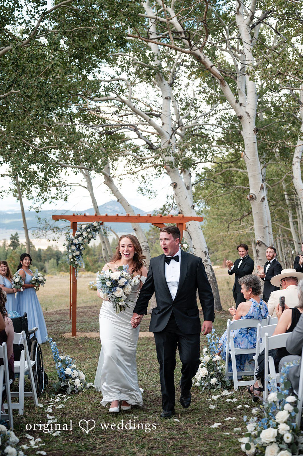 Erin + John Bride walking down the aisle with her father