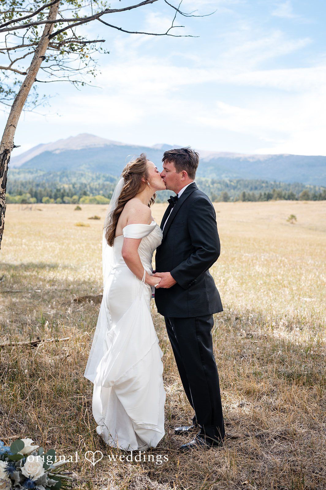 Erin + John Couple smiling at each other in the open field