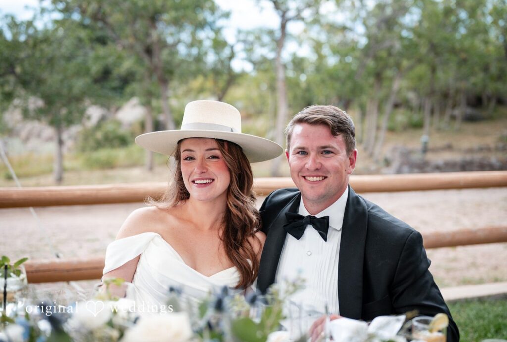 Colorado Backyard Wedding | Erin & John 1 Erin and John laughing together outdoors, captured by Denver wedding photographers from Original Weddings at their Colorado backyard wedding