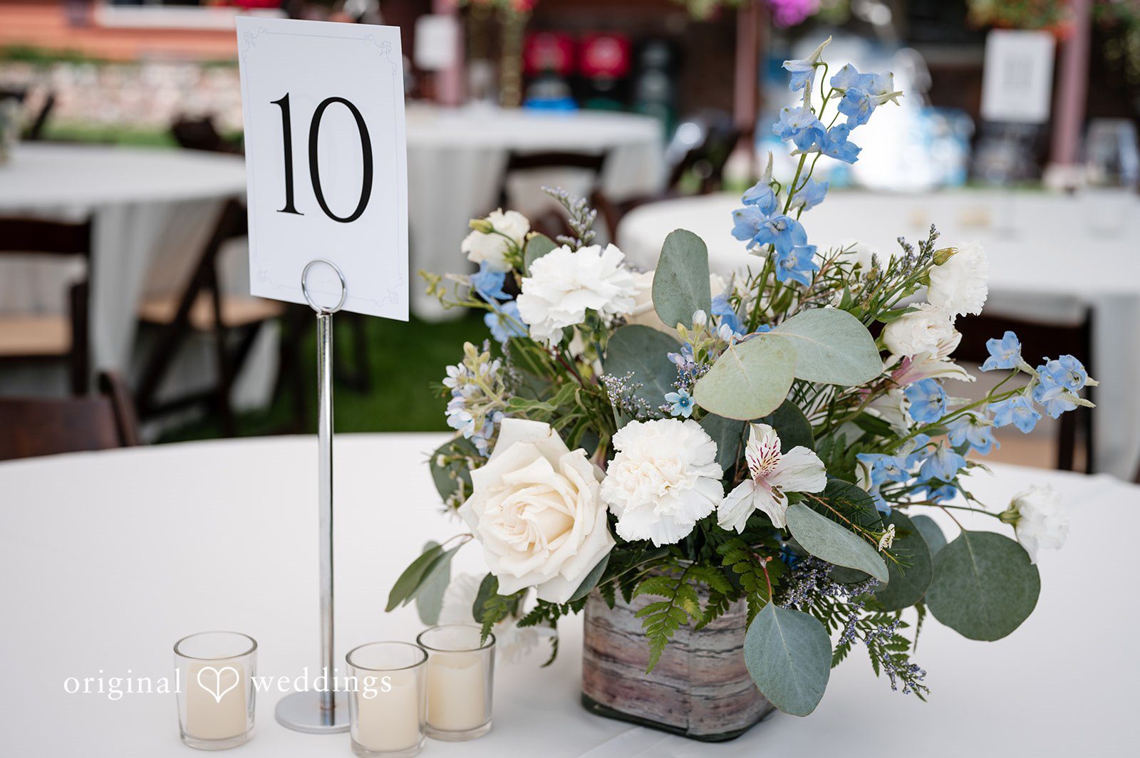 Erin + John Table centerpiece with white and blue flowers