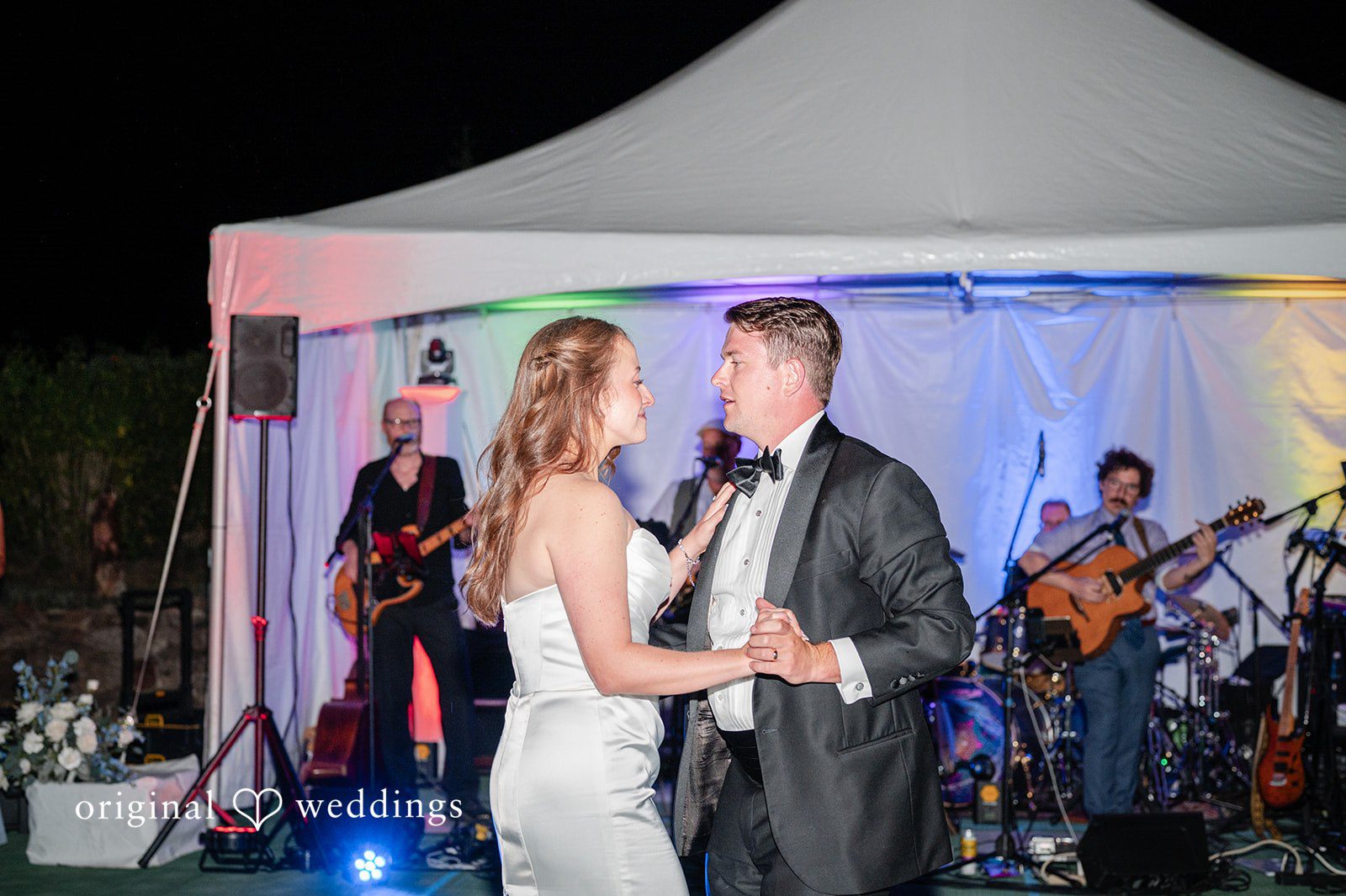 Erin + John Couple dancing with the live band under the tent
