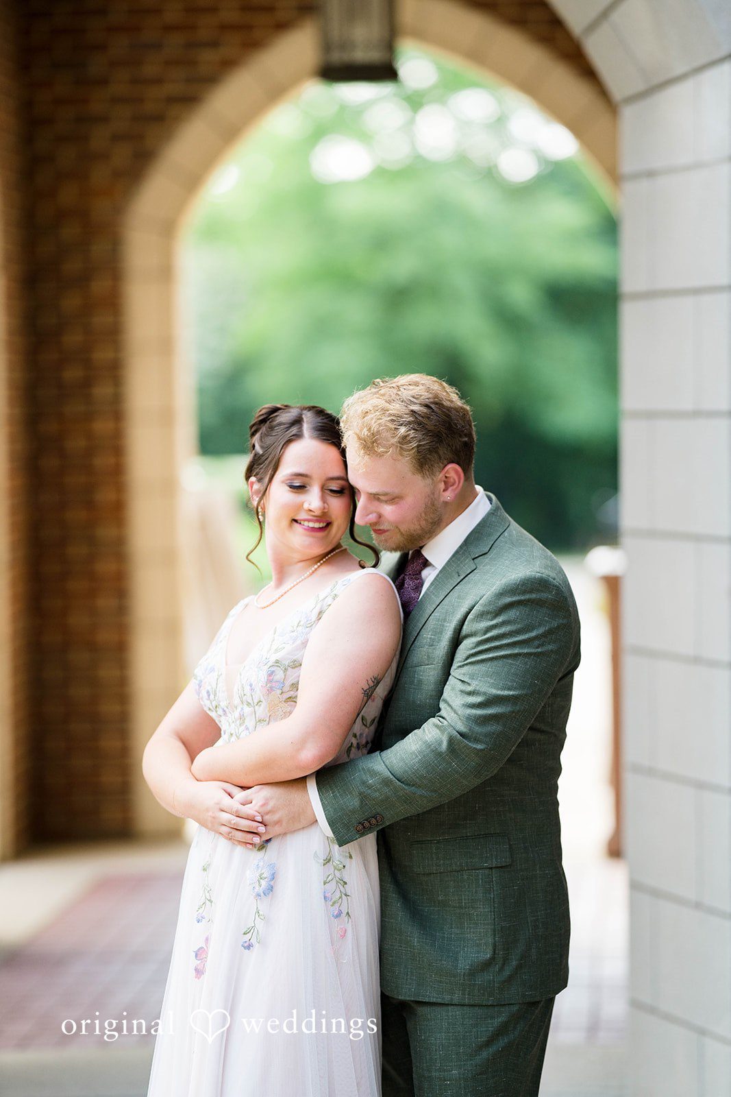 Griffin + Lauren Couple embracing in the archway