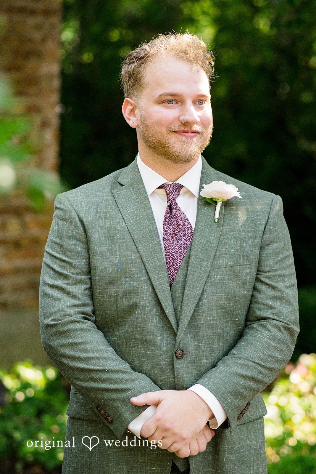 Griffin + Lauren Groom portrait in a green suit