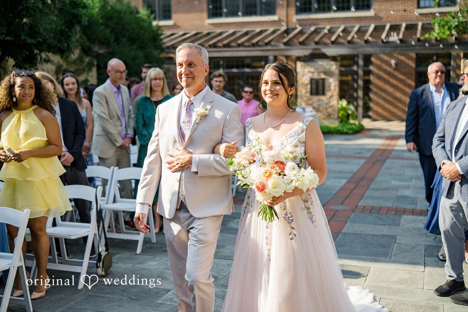 Griffin + Lauren Bride and her father walking past guests