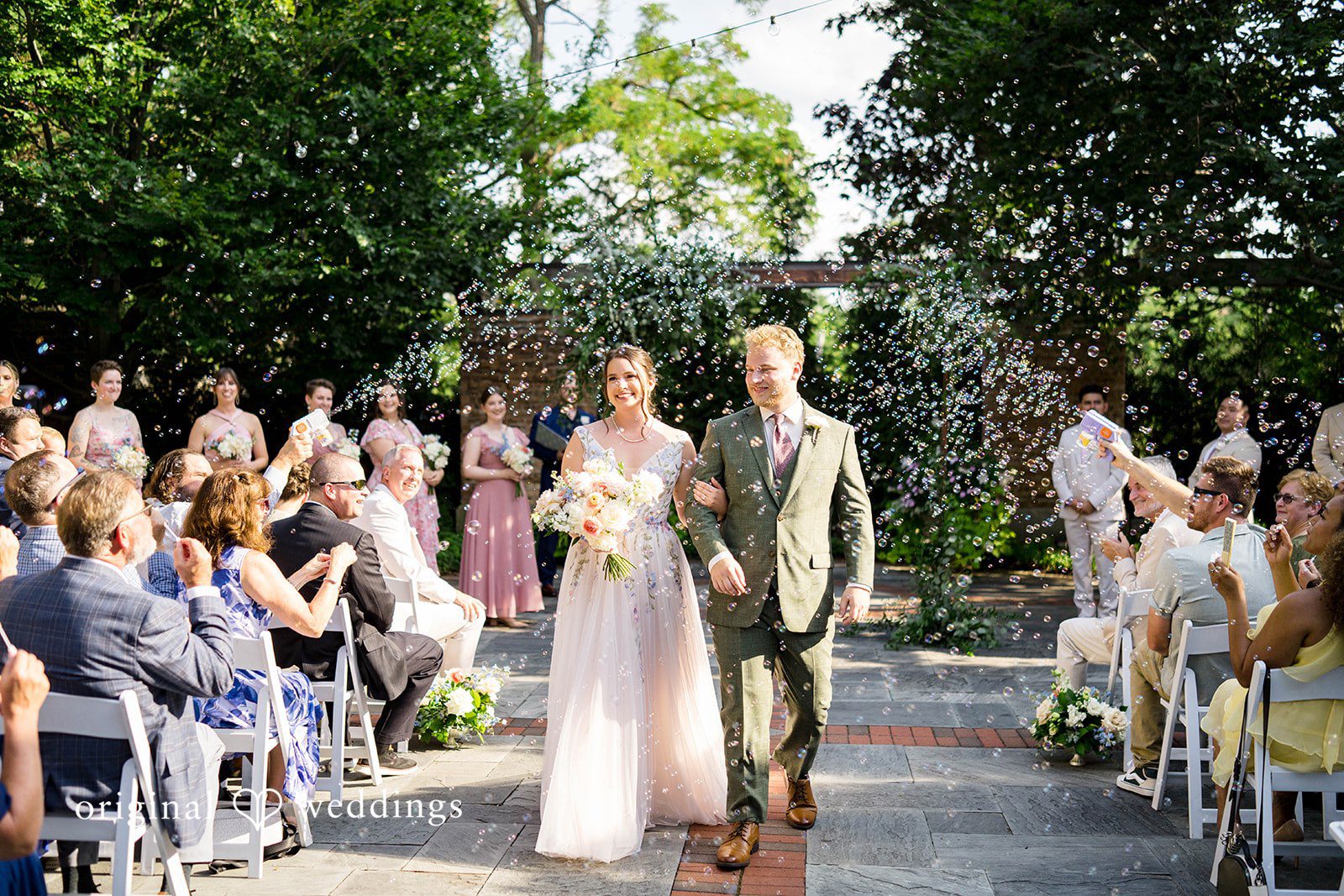 Griffin + Lauren Couple standing at the altar during the outdoor ceremony at Community House Winnetka