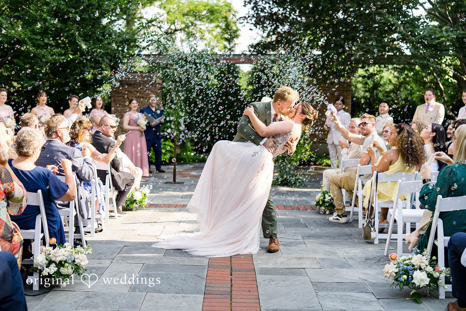 Griffin + Lauren Bride walking down the garden aisle at Community House Winnetka