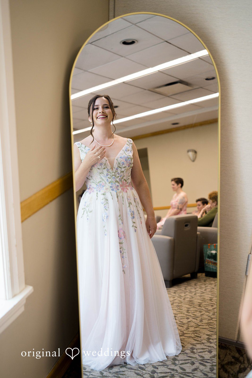 Griffin + Lauren Bride getting ready by the window