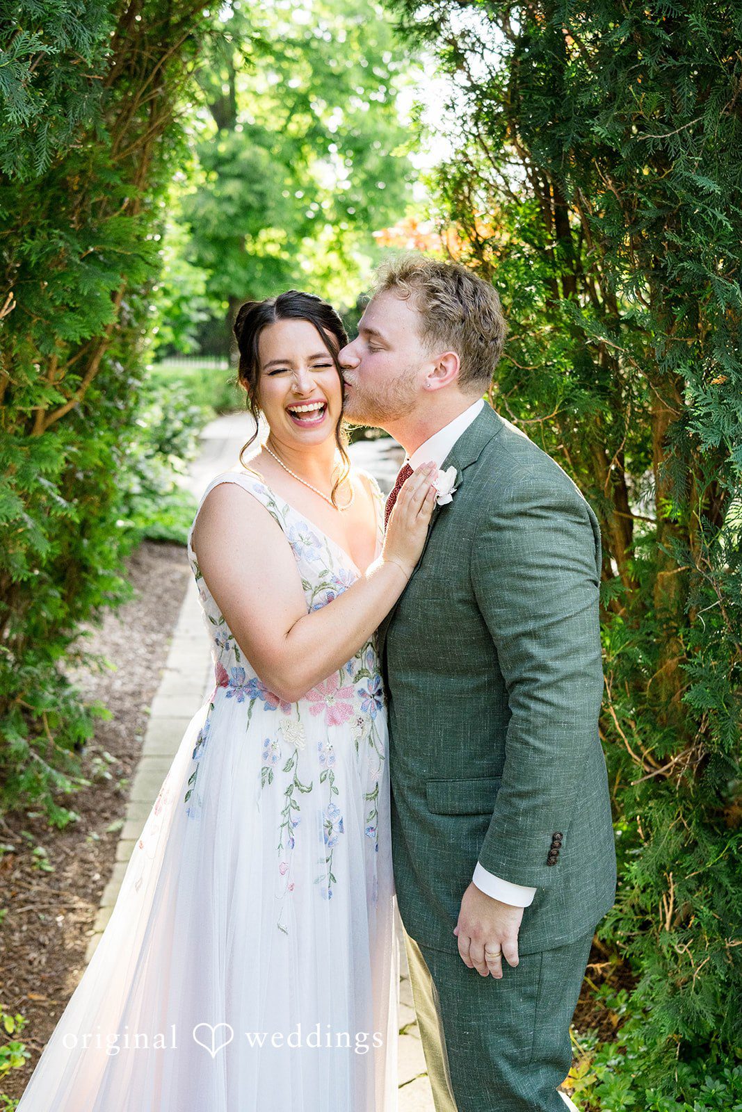 Griffin + Lauren Couple sharing a kiss in the garden