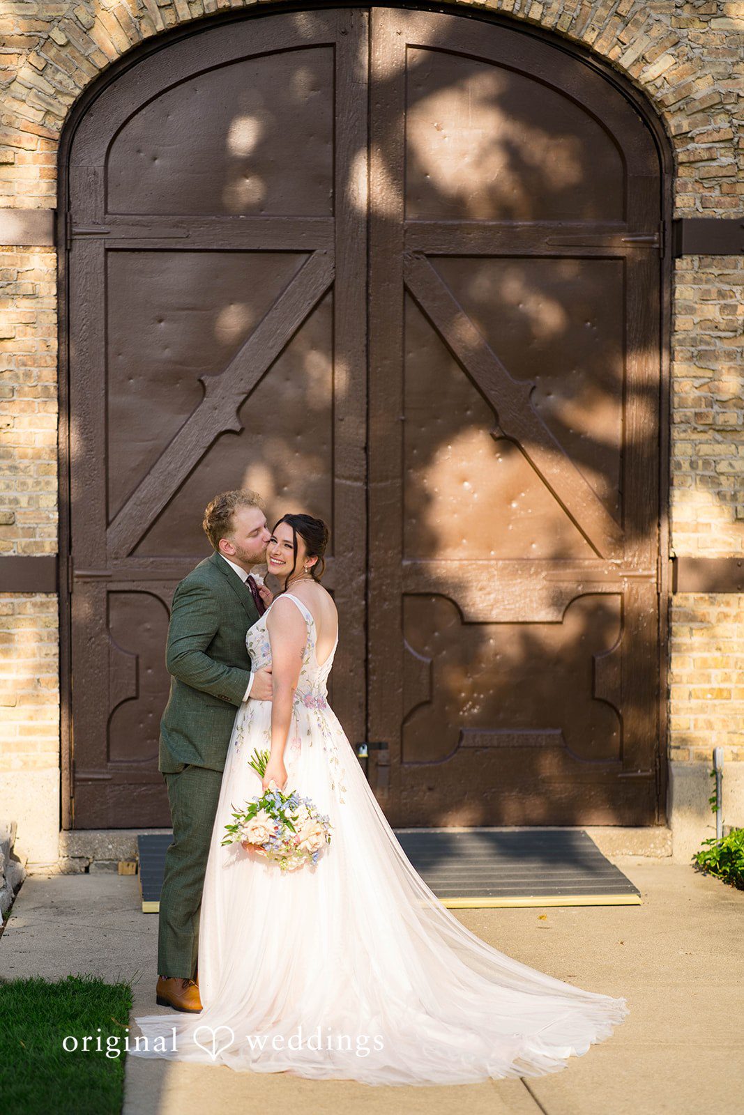 Griffin + Lauren Couple by the wooden doors at Community House Winnetka