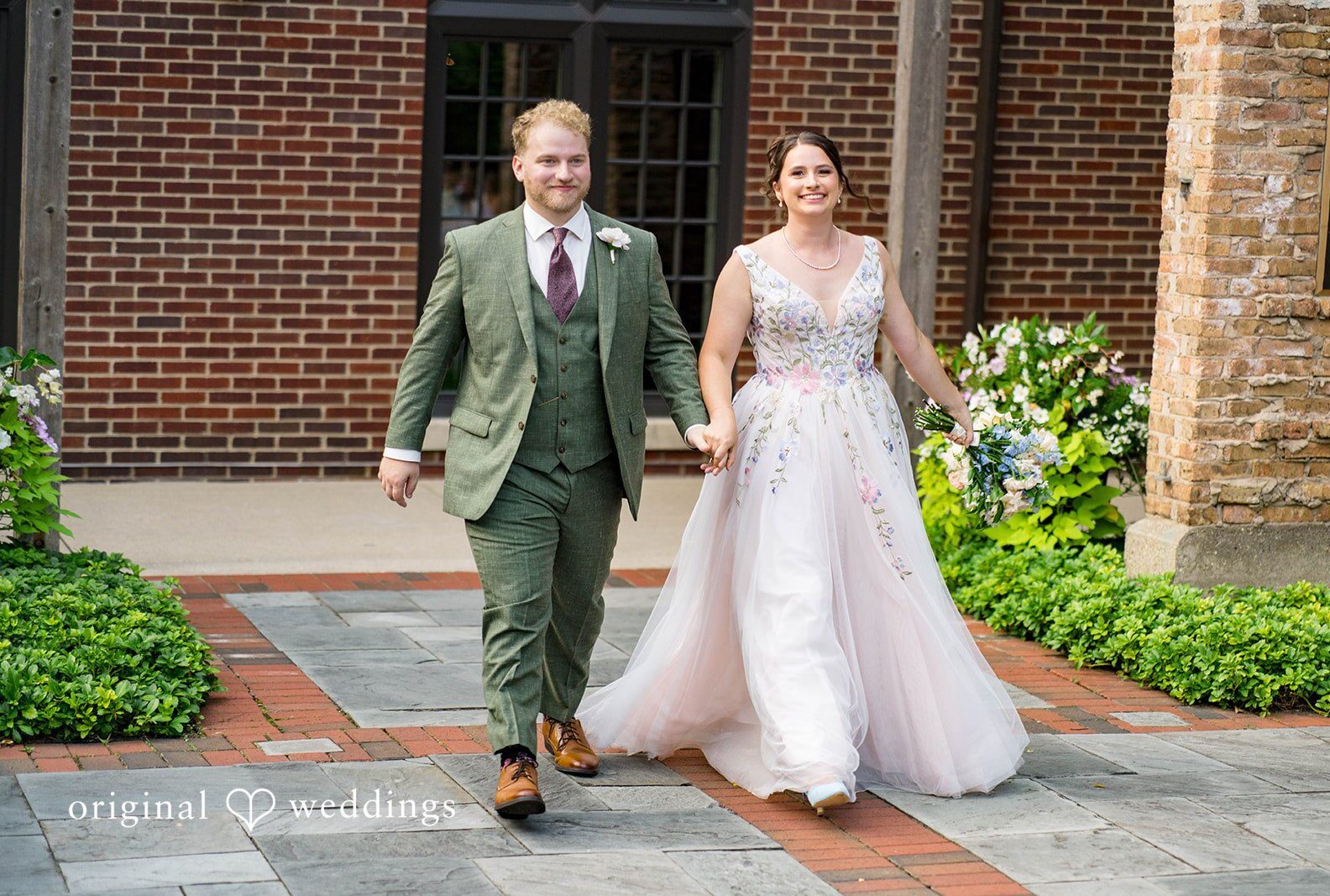 Couple walking hand in hand through the garden, captured by Chicago wedding photographers from Original Weddings at Community House Winnetka