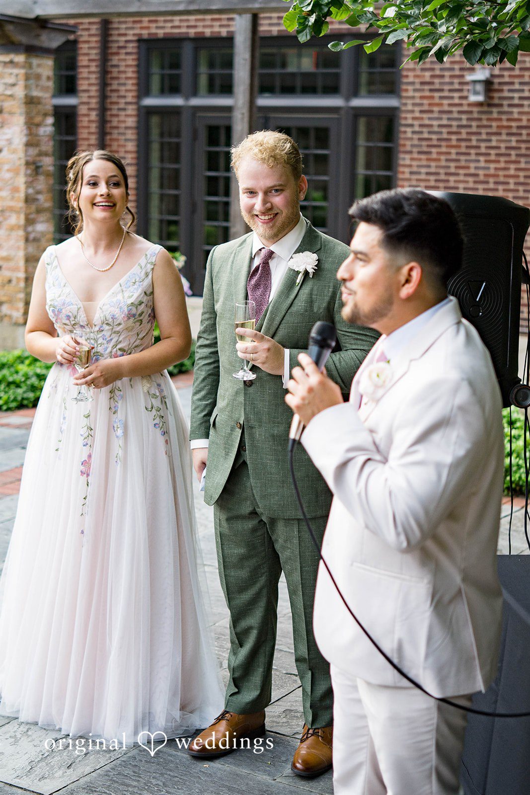 Griffin + Lauren Couple sharing a laugh with a guest