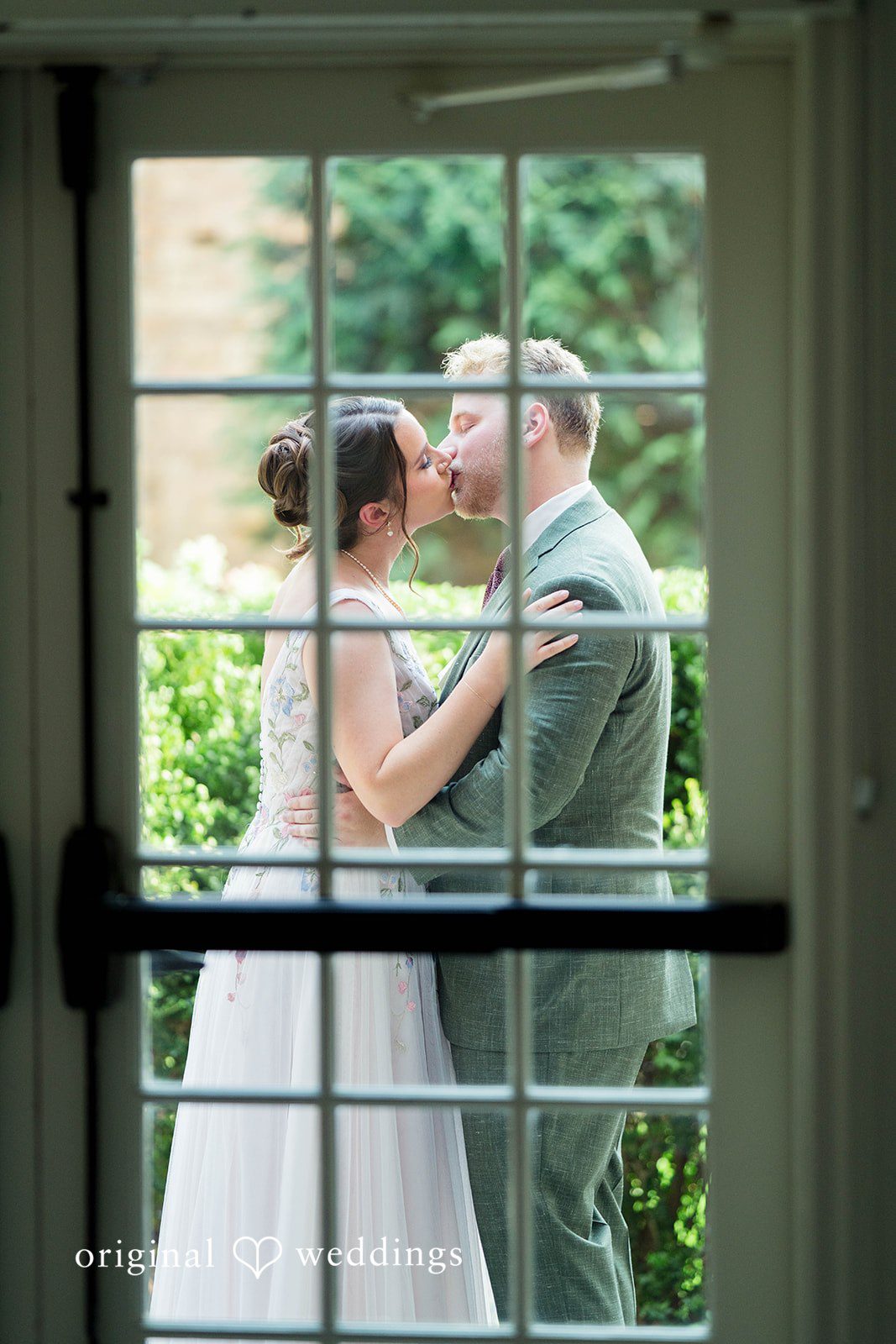 Griffin + Lauren Bride waiting behind a glass door before seeing the groom