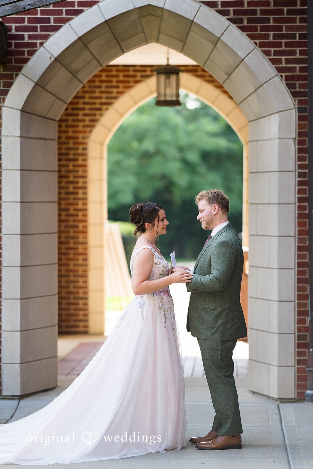 Griffin + Lauren Couple posing in the brick archway