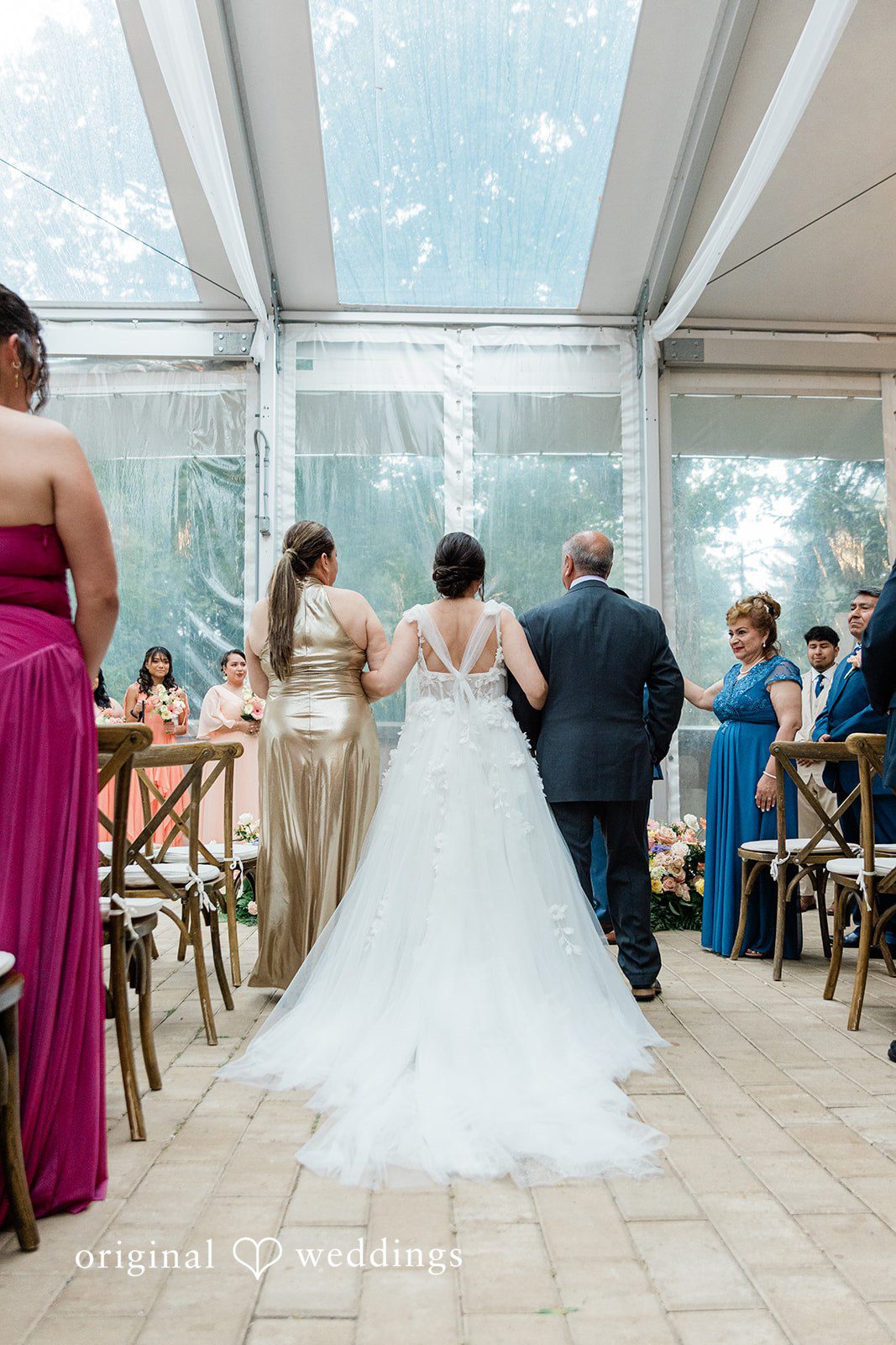 Bride walking down the aisle inside the hall