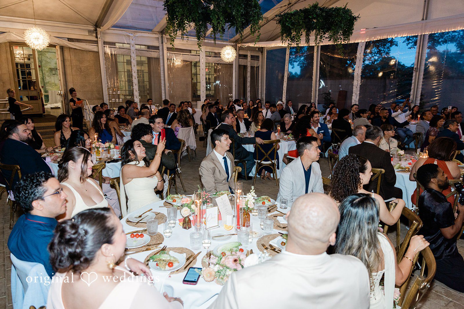 Reception tables filled with guests at Curtis Arboretum