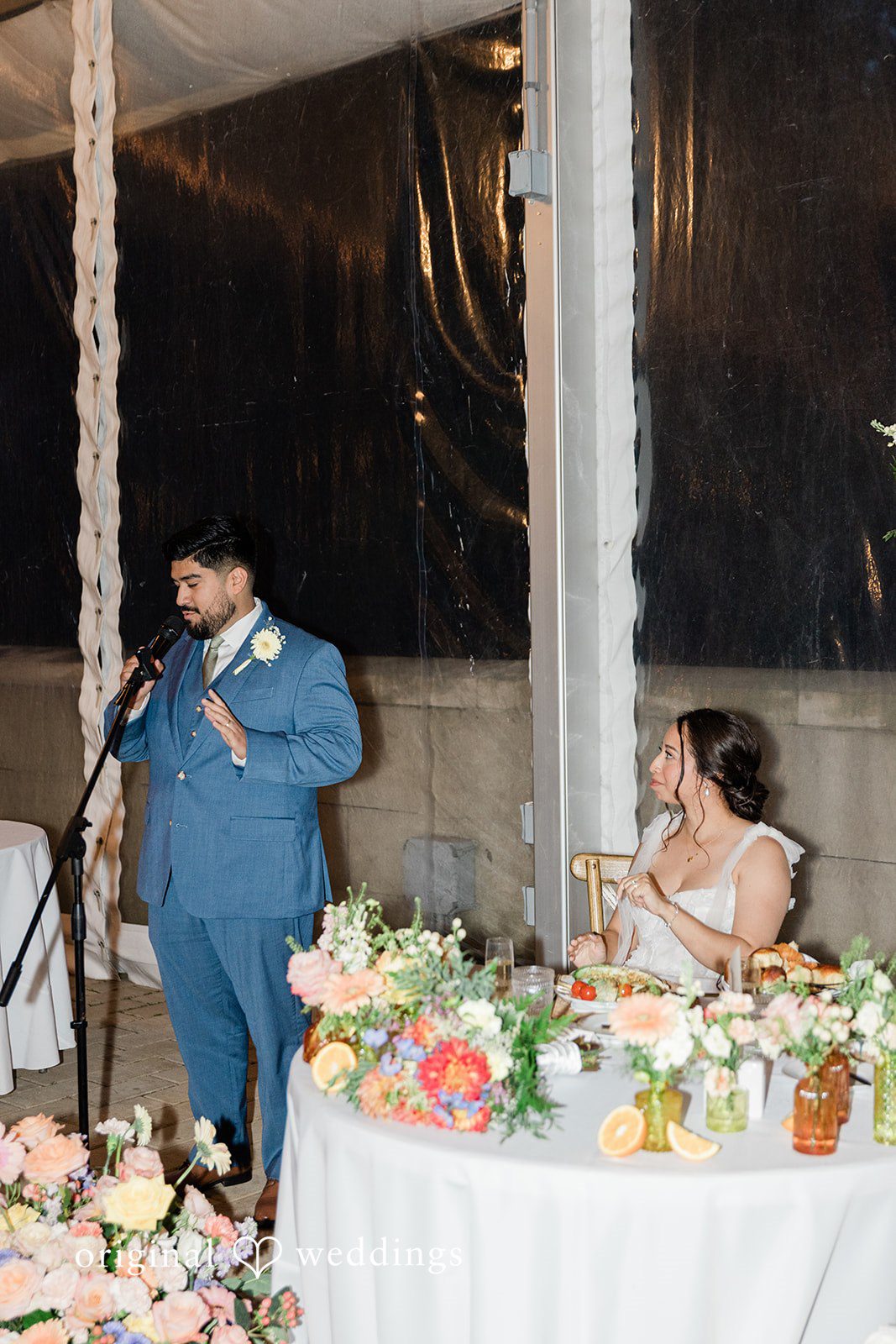 Groom by the sweetheart table