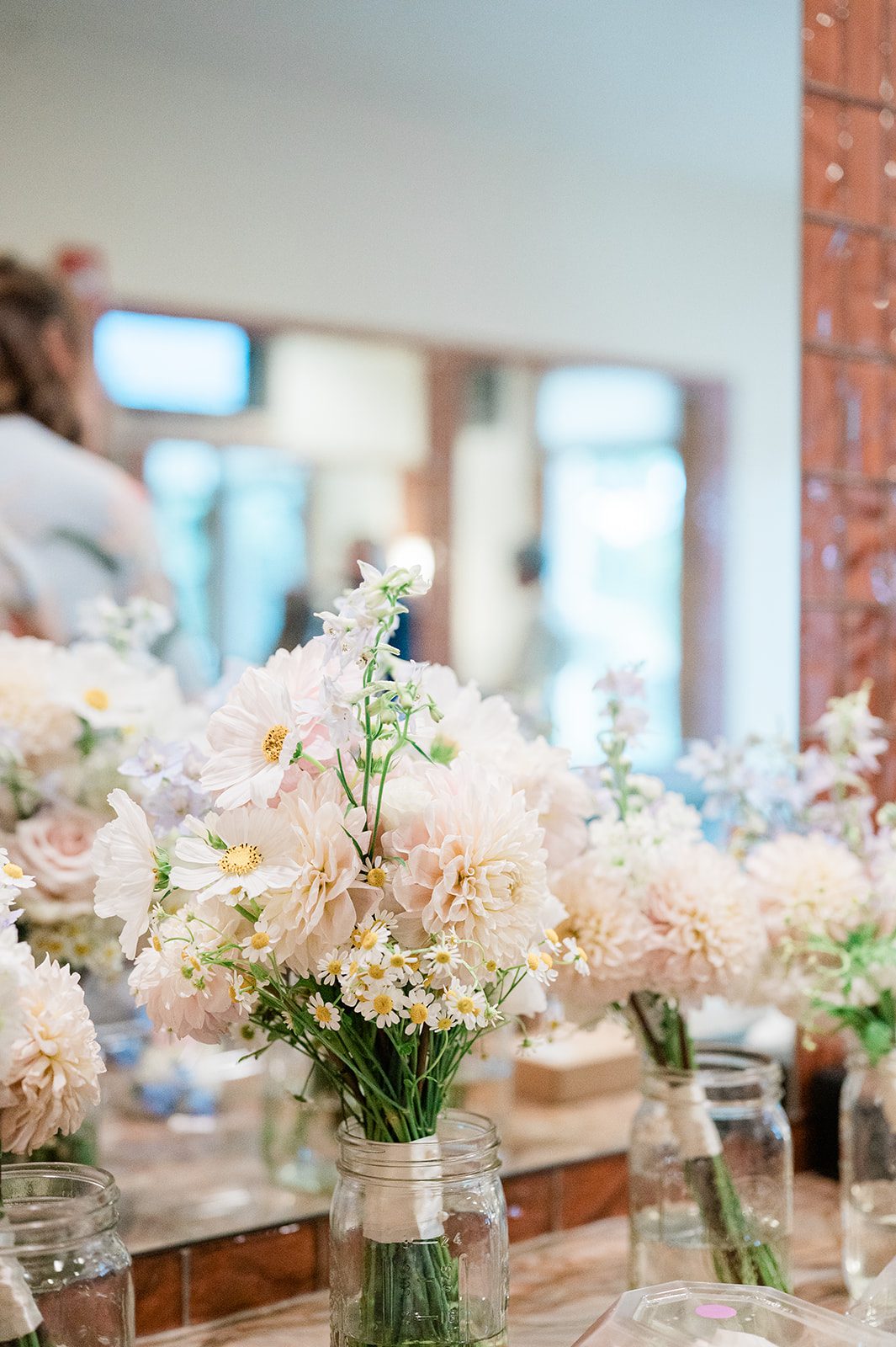 Bridal bouquets in soft pastel flowers by the window