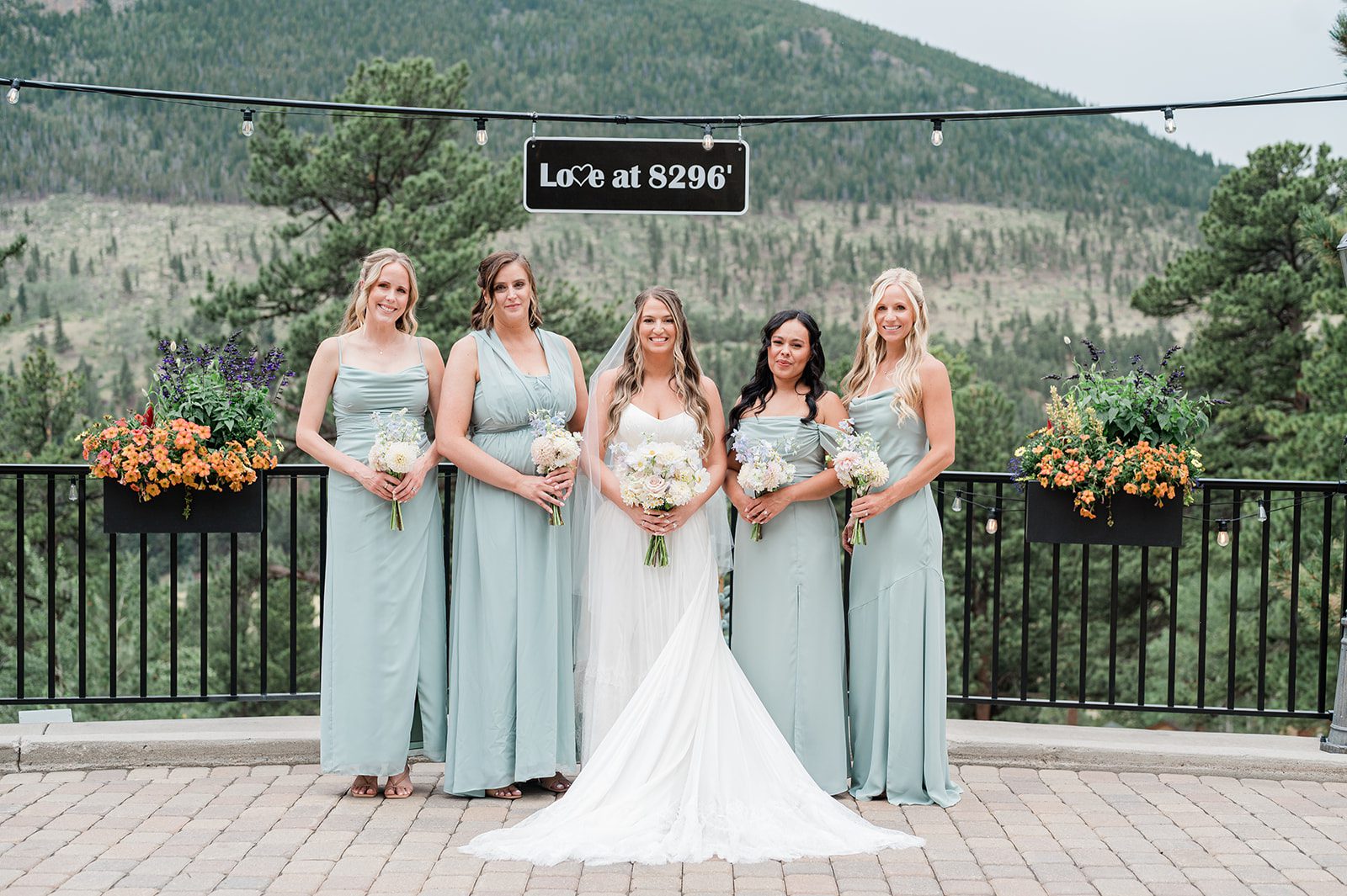 Bride with bridesmaids in sage green dresses at Della Terra Mountain Chateau