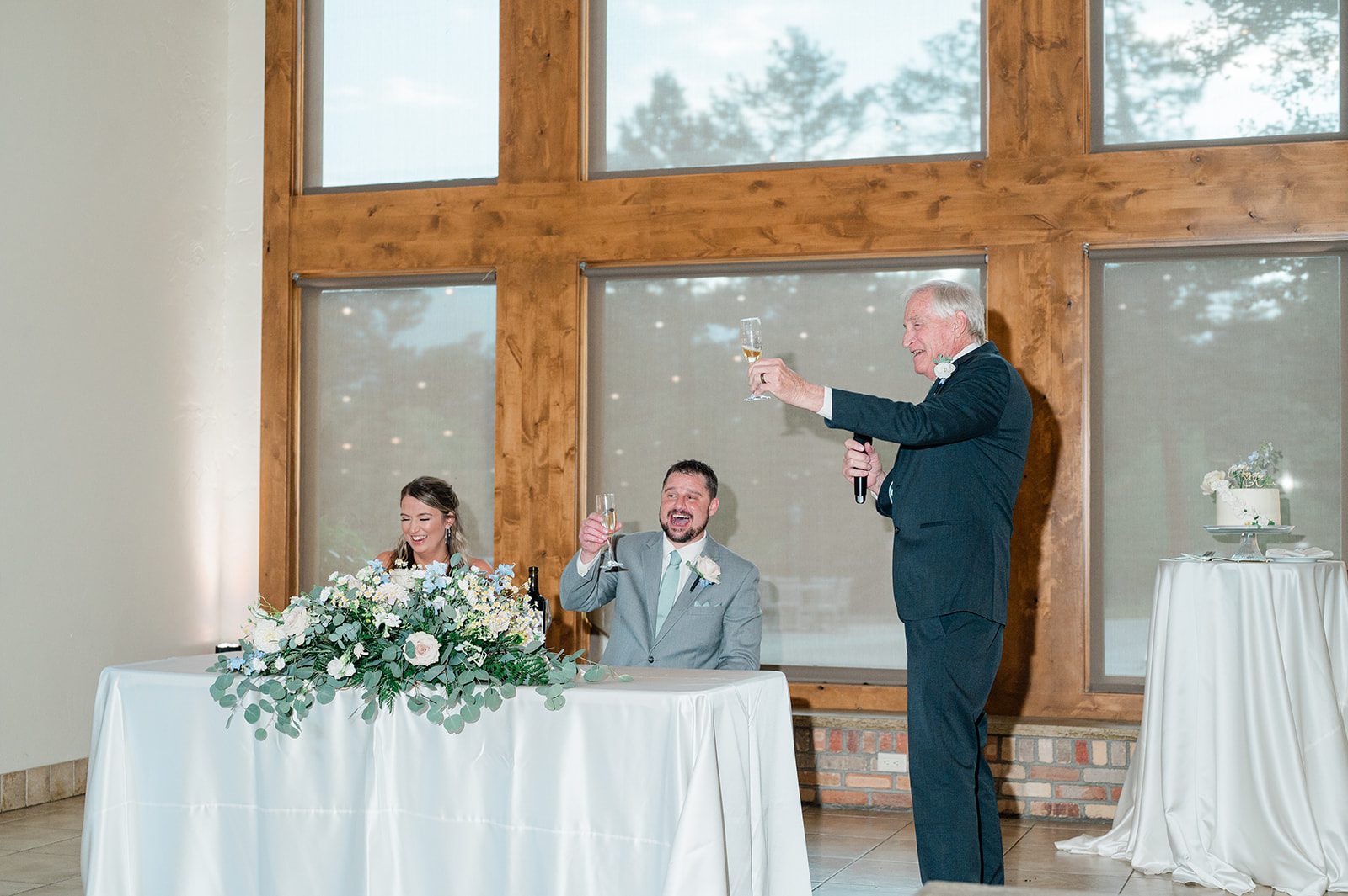 Wedding guest giving a toast at the reception
