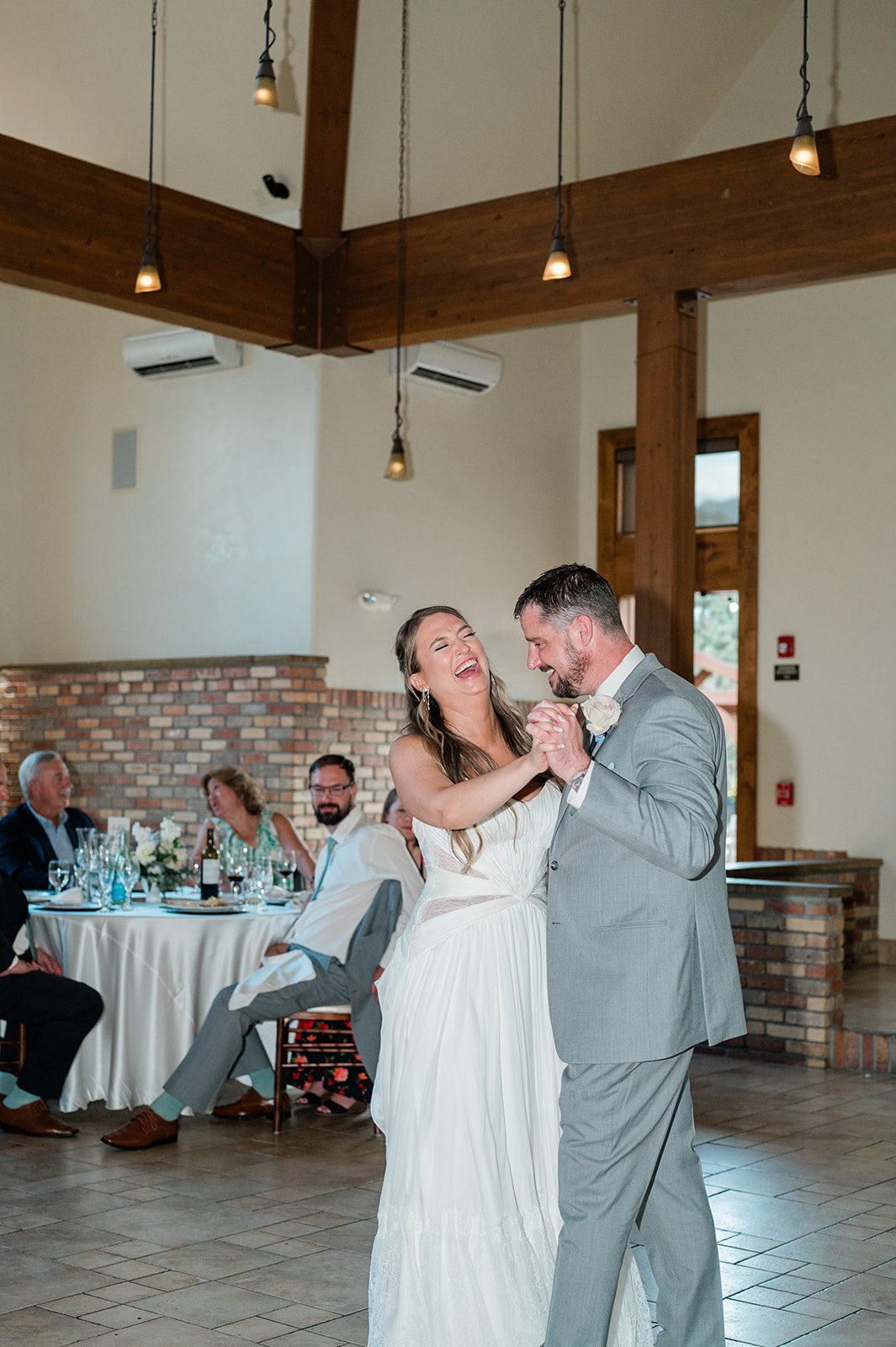 Newlyweds dancing in the reception hall