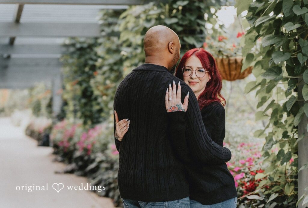 Denver Botanic Gardens Engagement | Nikki & Kevin 4 Couple embracing among the garden flowers, captured by Engagement Photography Services from Original Weddings at Denver Botanic Gardens