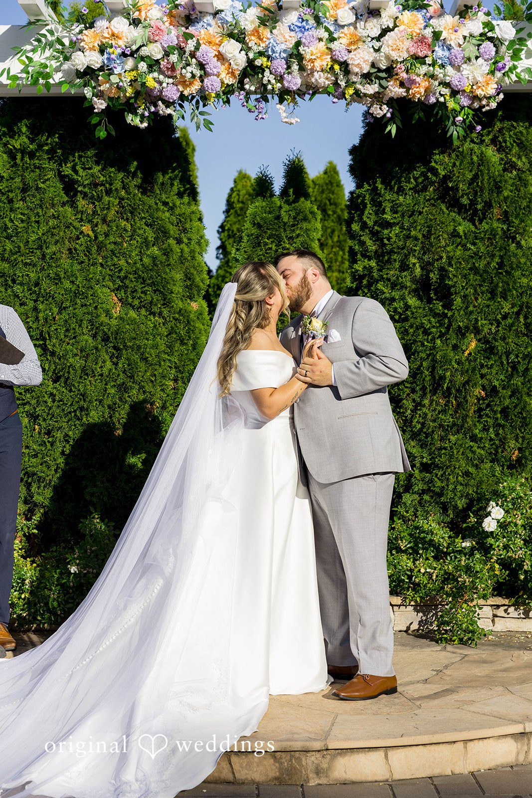 The couple shares a kiss