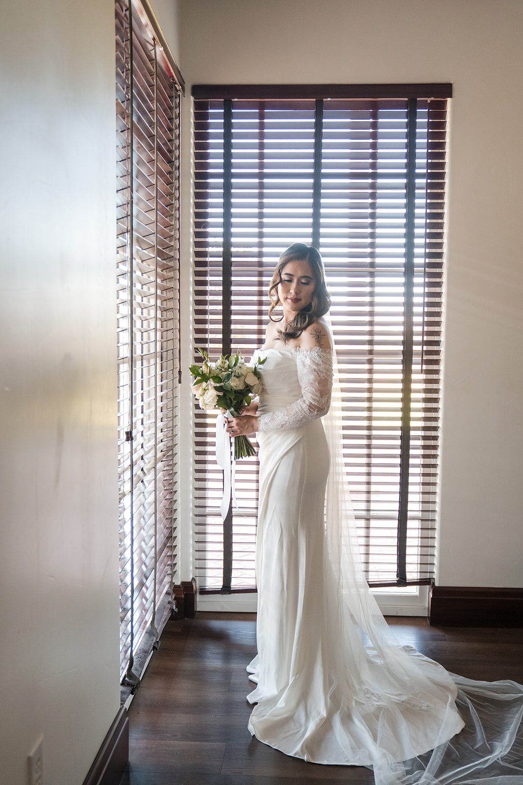 eagle-ridge-timeless-san-francisco-jesse-victoria-jesse-victoria-007-06 Bride standing in the window light in her gown