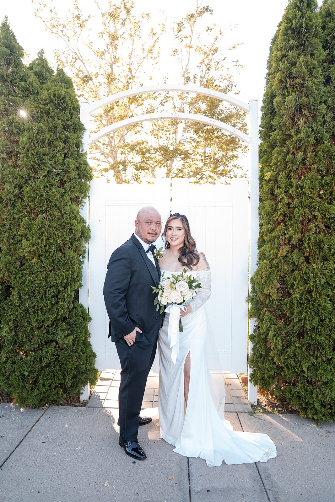 eagle-ridge-timeless-san-francisco-jesse-victoria-jesse-victoria-024-02 Couple posing at the white garden gate