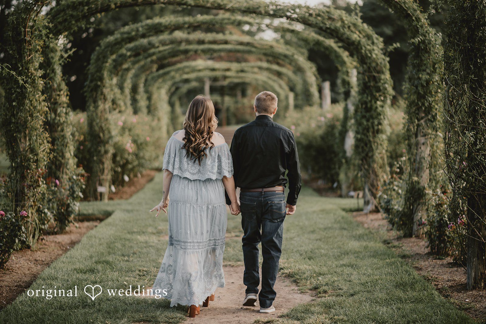 September 24, 2026 – Kaitlynn & Samuel – (ID-5685) Couple walking hand in hand through the arbor tunnel