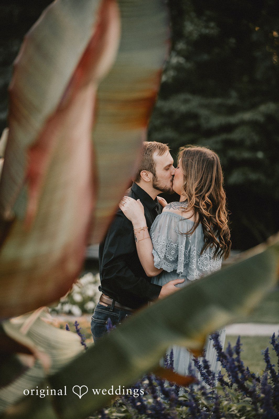 September 24, 2026 – Kaitlynn & Samuel – (ID-5685) Couple kissing framed by garden leaves