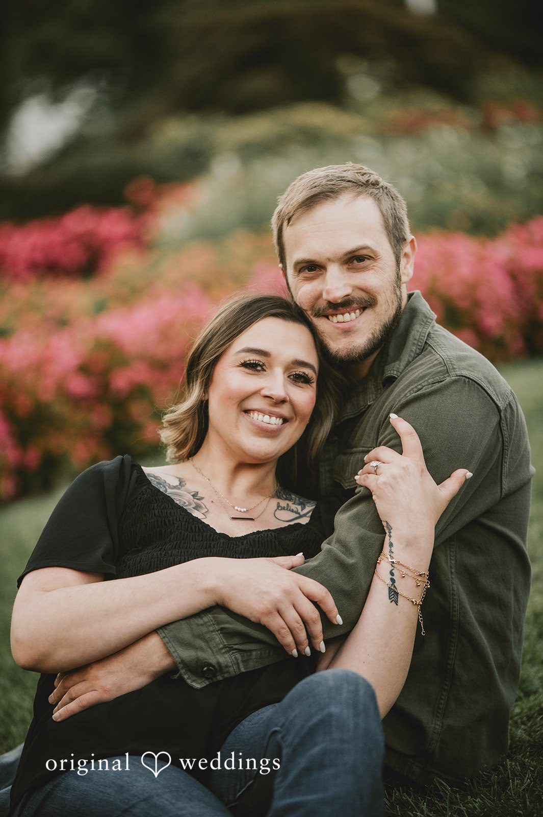 September 24, 2026 – Kaitlynn & Samuel – (ID-5685) Couple smiling close together near pink flowers at Elizabeth Park