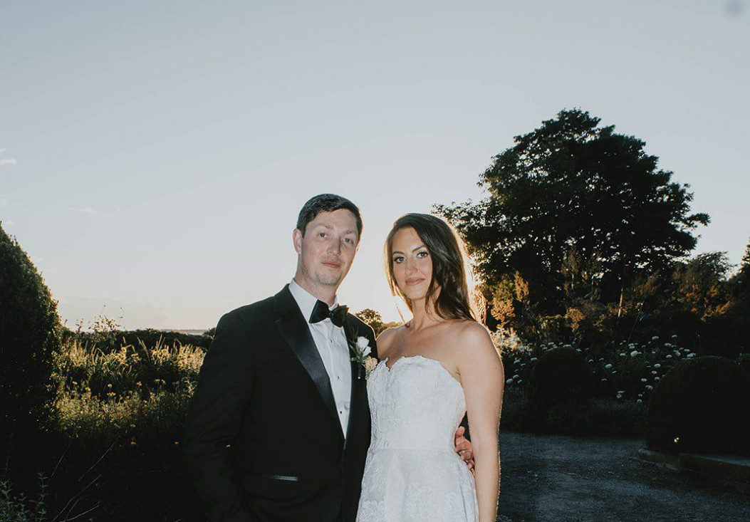 Bride and groom smiling together at dusk, captured by Hartford wedding photographers from Original Weddings at Eolia Mansion