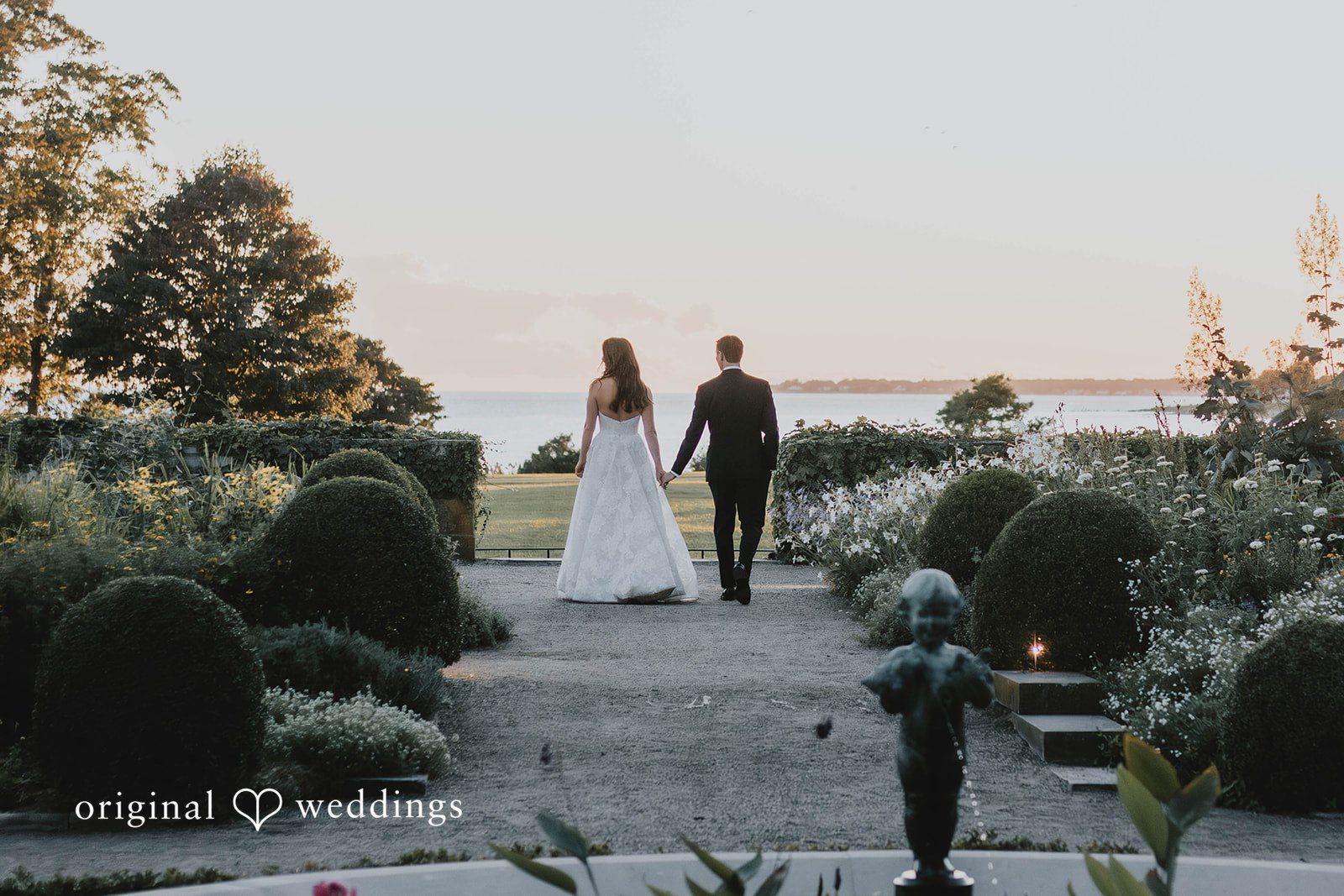 Alexa + Frank Couple walking through the gardens toward the water at Eolia Mansion
