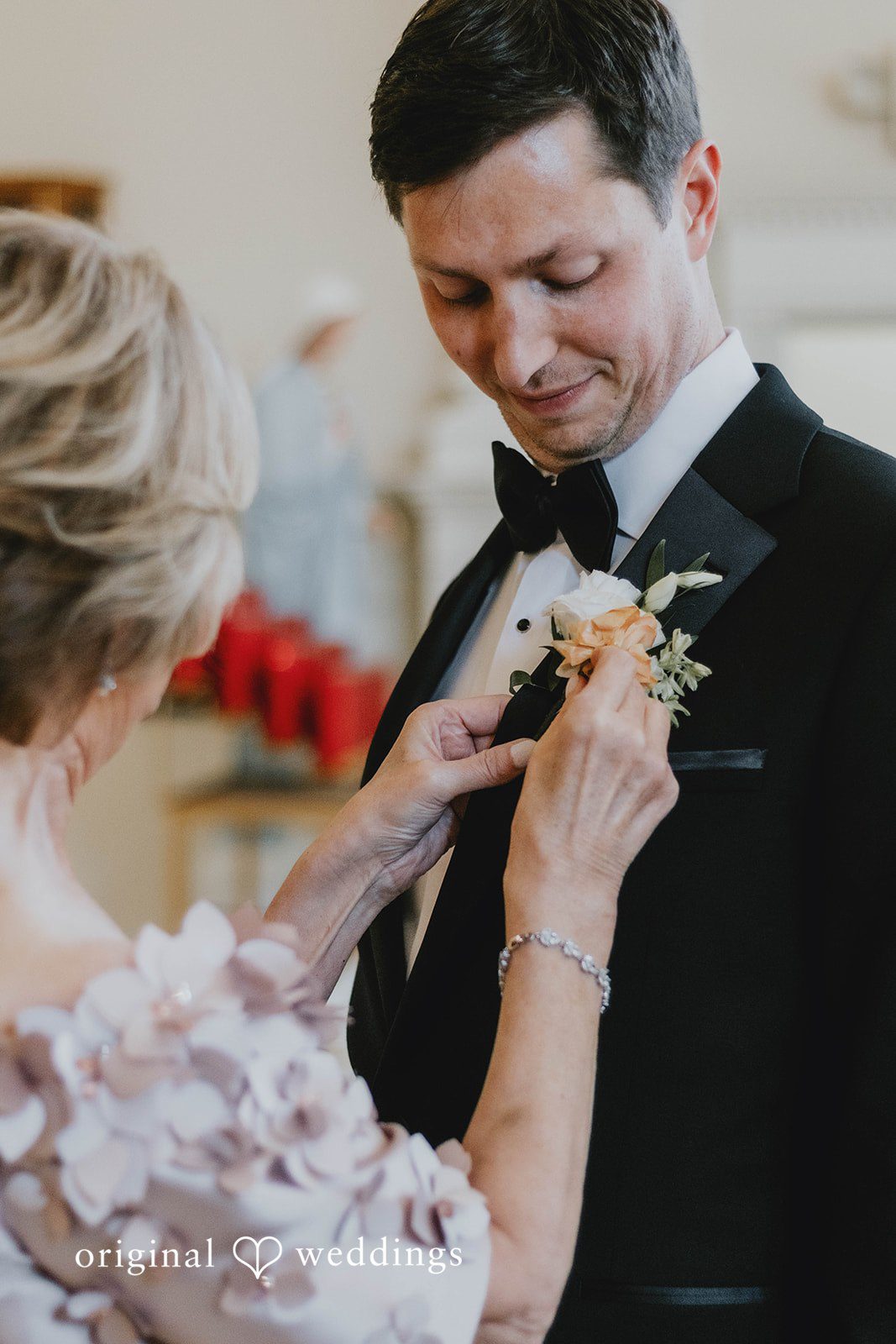 Alexa + Frank Groom having his boutonniere pinned on