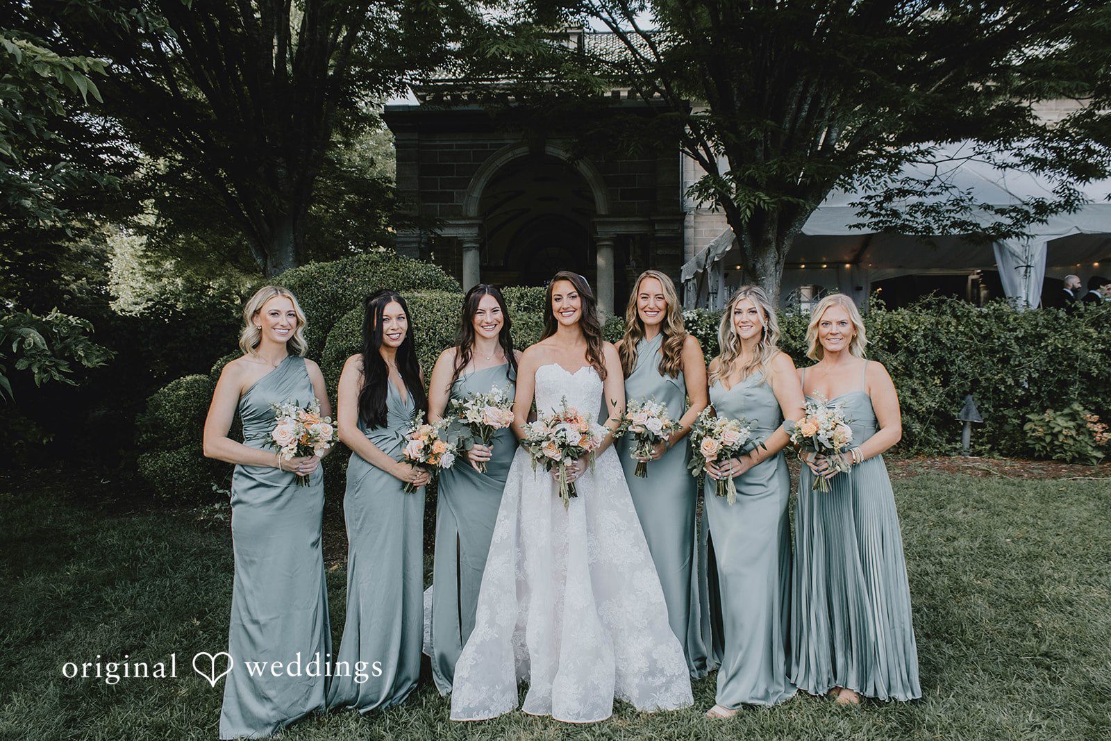 Alexa + Frank Bridesmaids in sage green dresses with the bride
