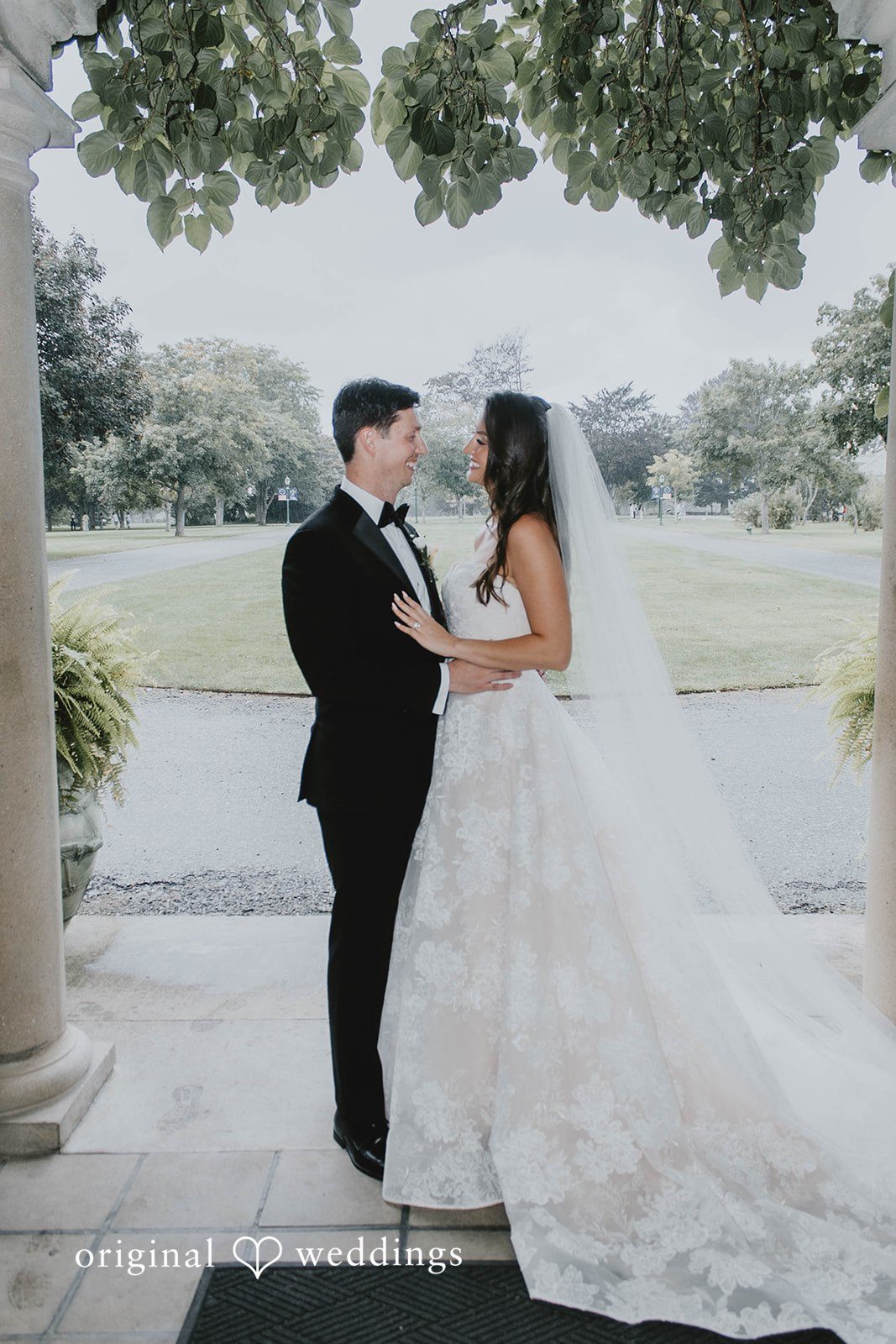 Alexa + Frank Couple under the columned portico at Eolia Mansion