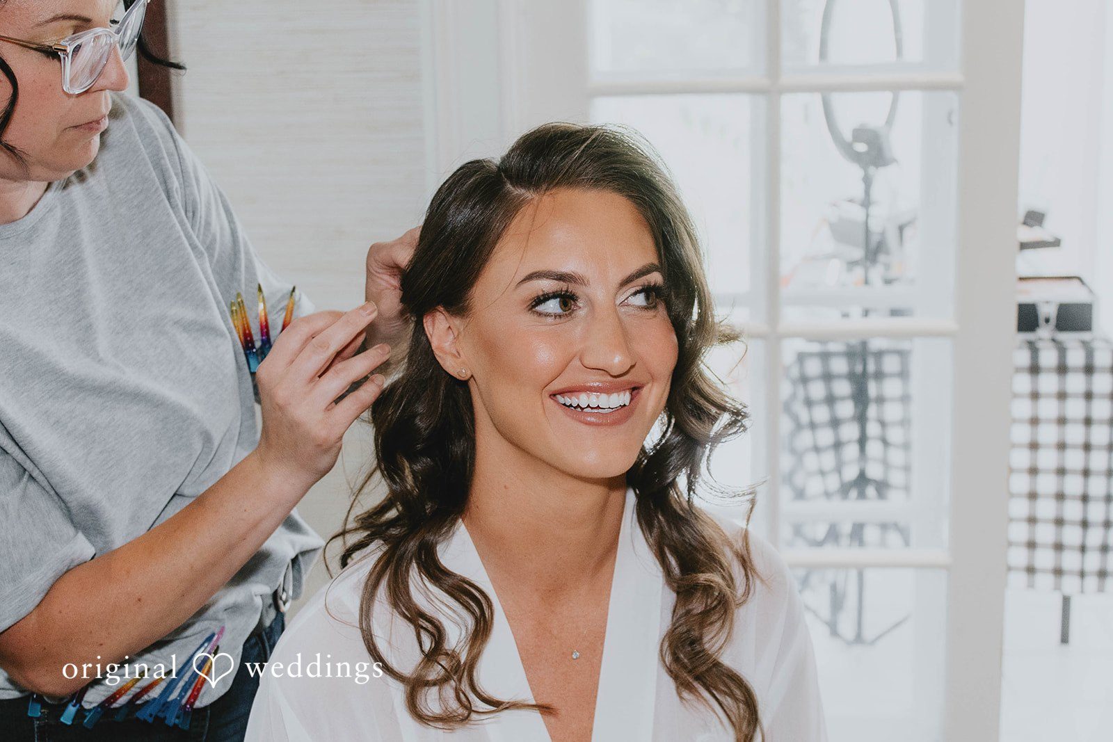 Alexa + Frank Bride smiling while her makeup is finished