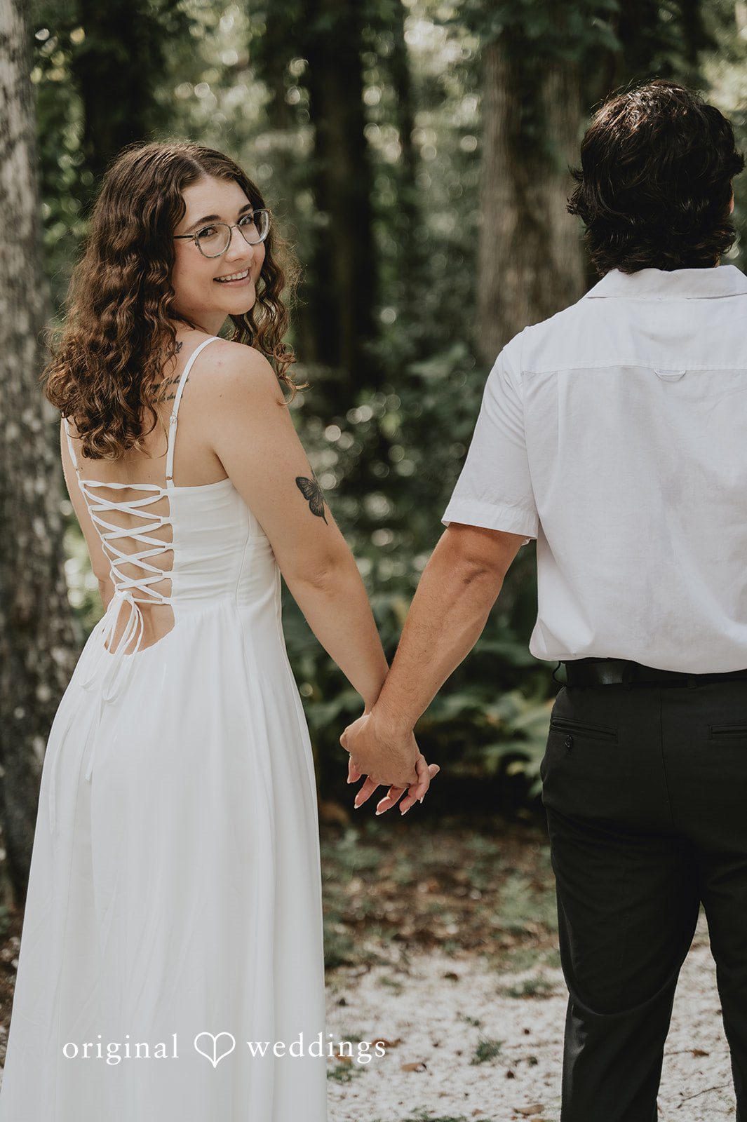 Larissa + Harley Larissa and Harley walking hand in hand on the trail at Eureka Springs Conservation Park