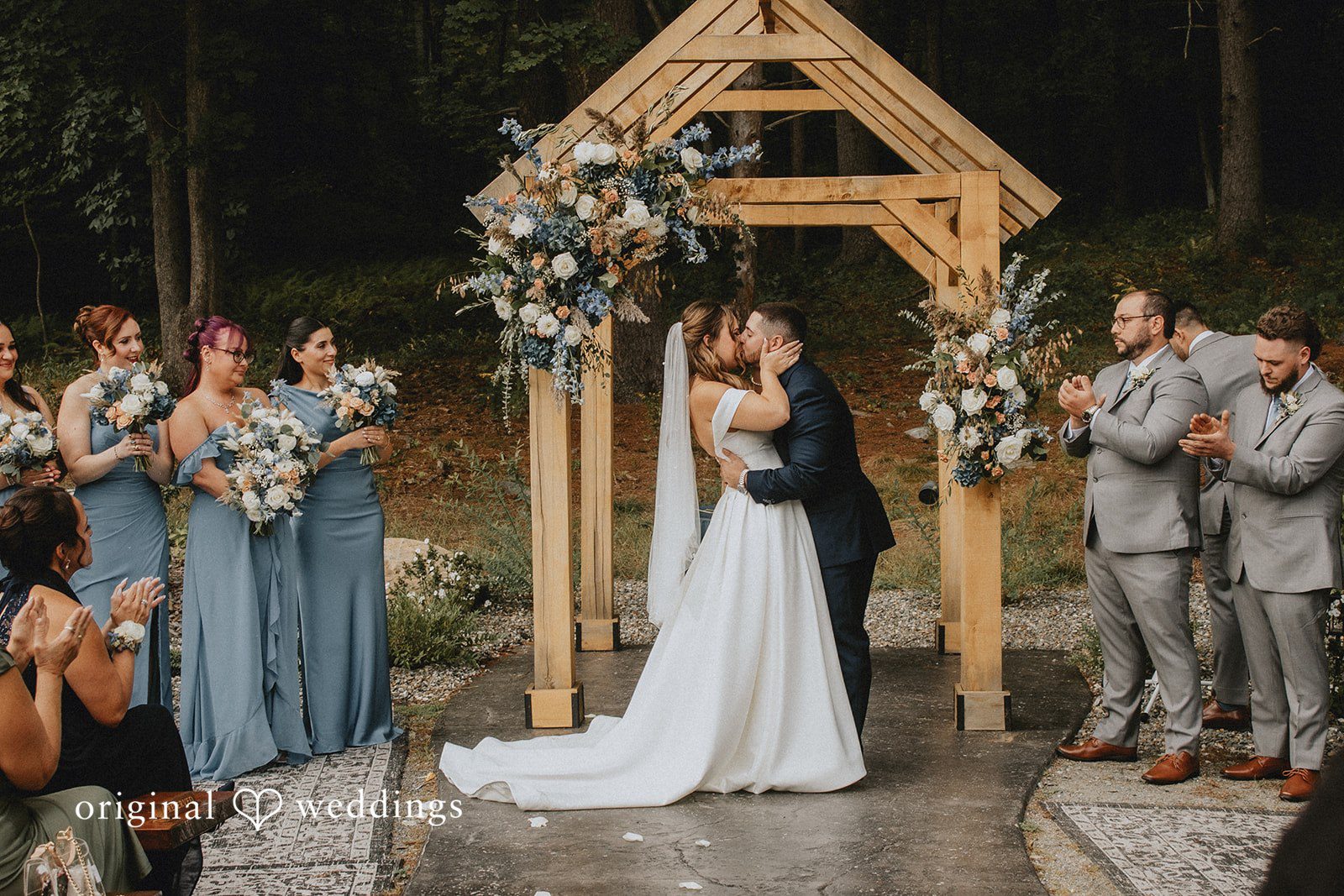 Sarah + Christopher A bride and groom sharing kiss at Evergreen Farms,