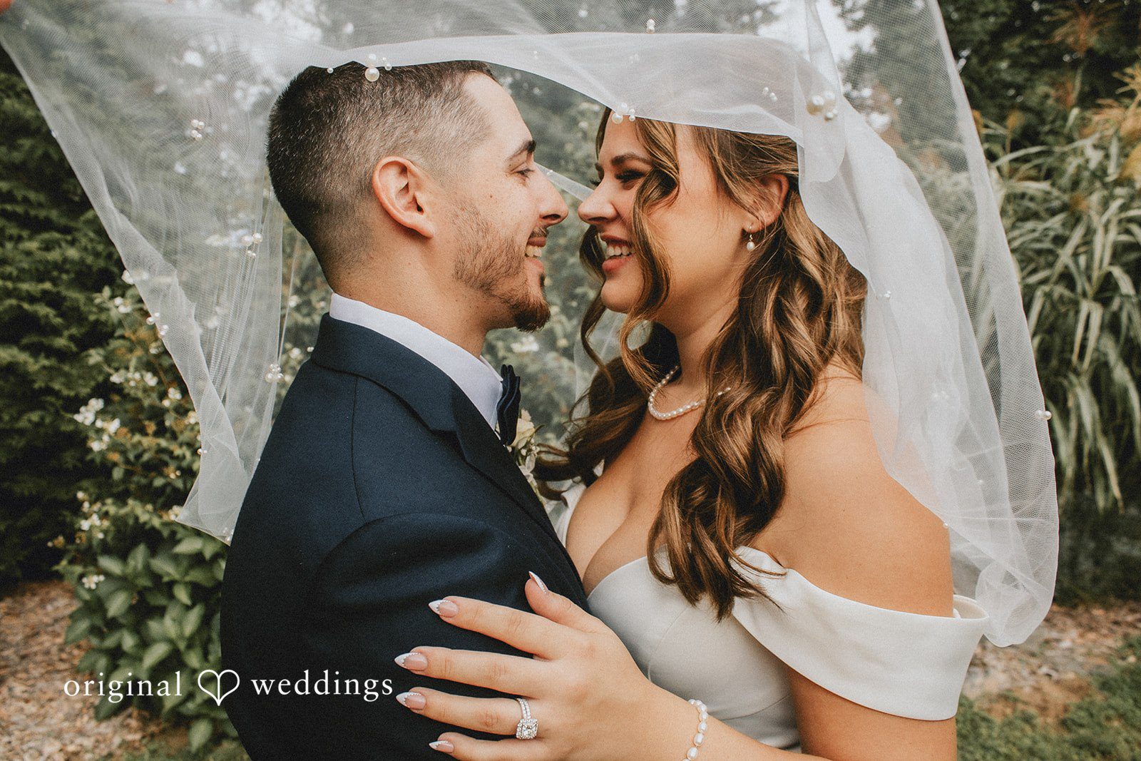 September 19, 2026 – Sarah & Christopher – (ID-4569) A bride and groom looking at each other affectionately while posing outdoors.