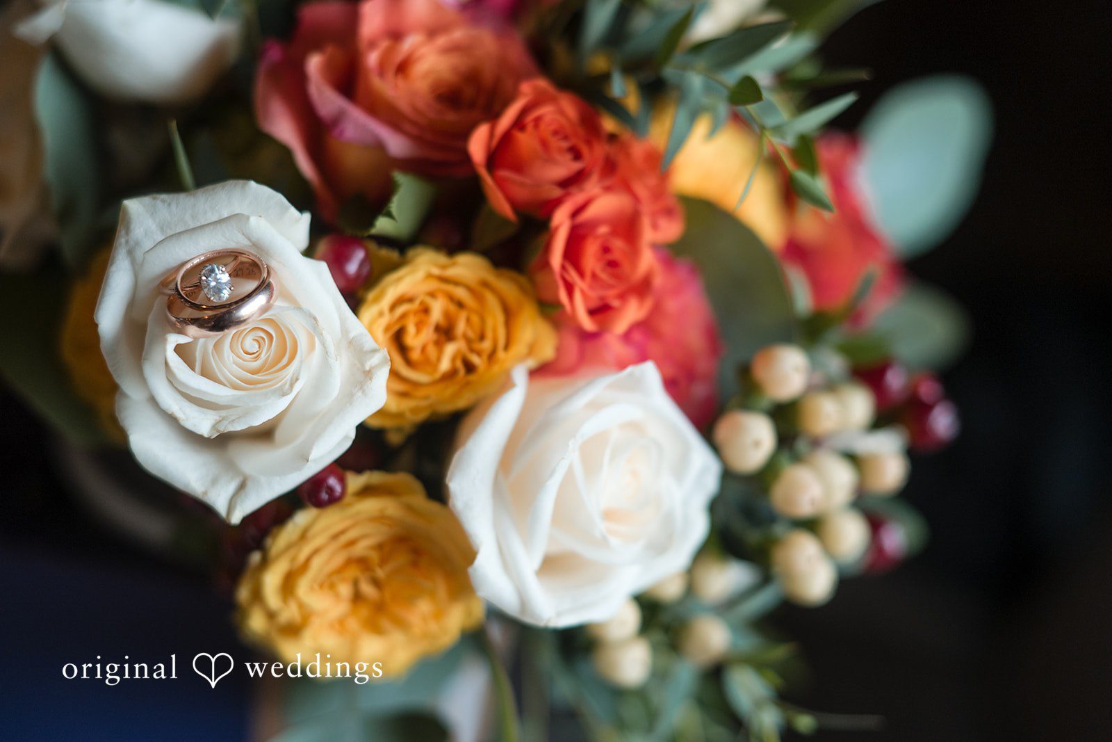 Bridal bouquet holding the wedding rings at Fern Hill Barn