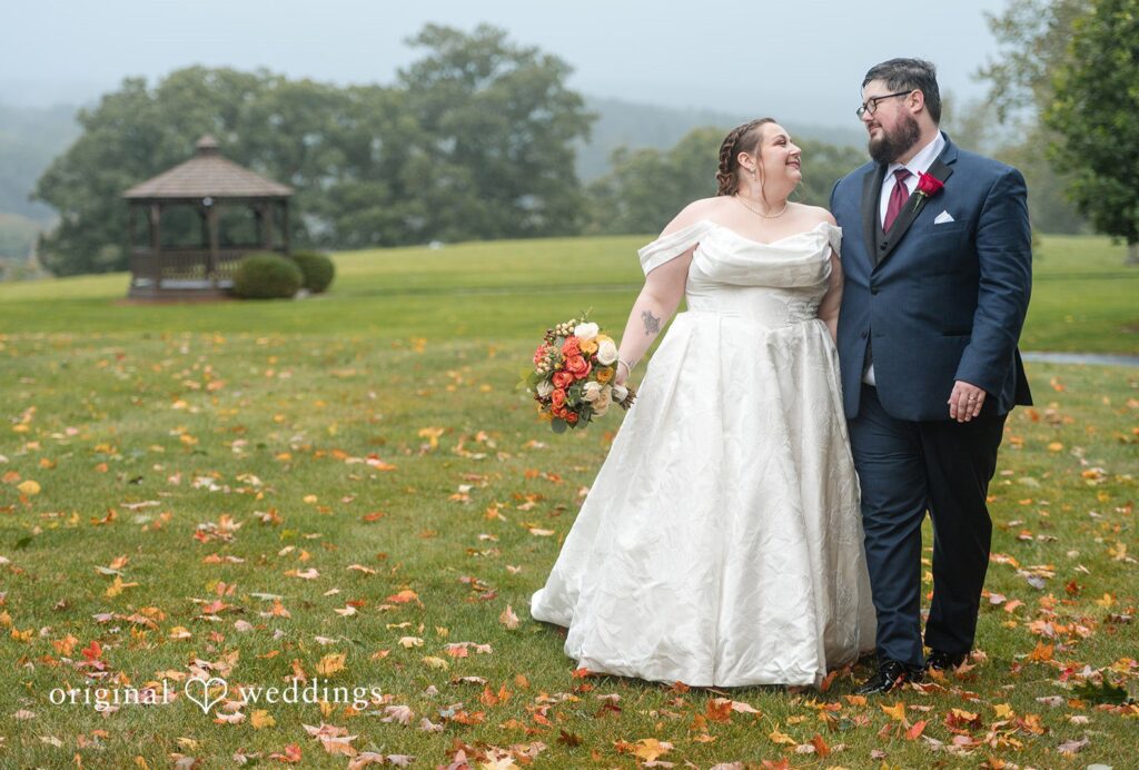 Andrew and Marian standing together on the lawn, captured by Boston wedding photographers from Original Weddings at Fern Hill Barn