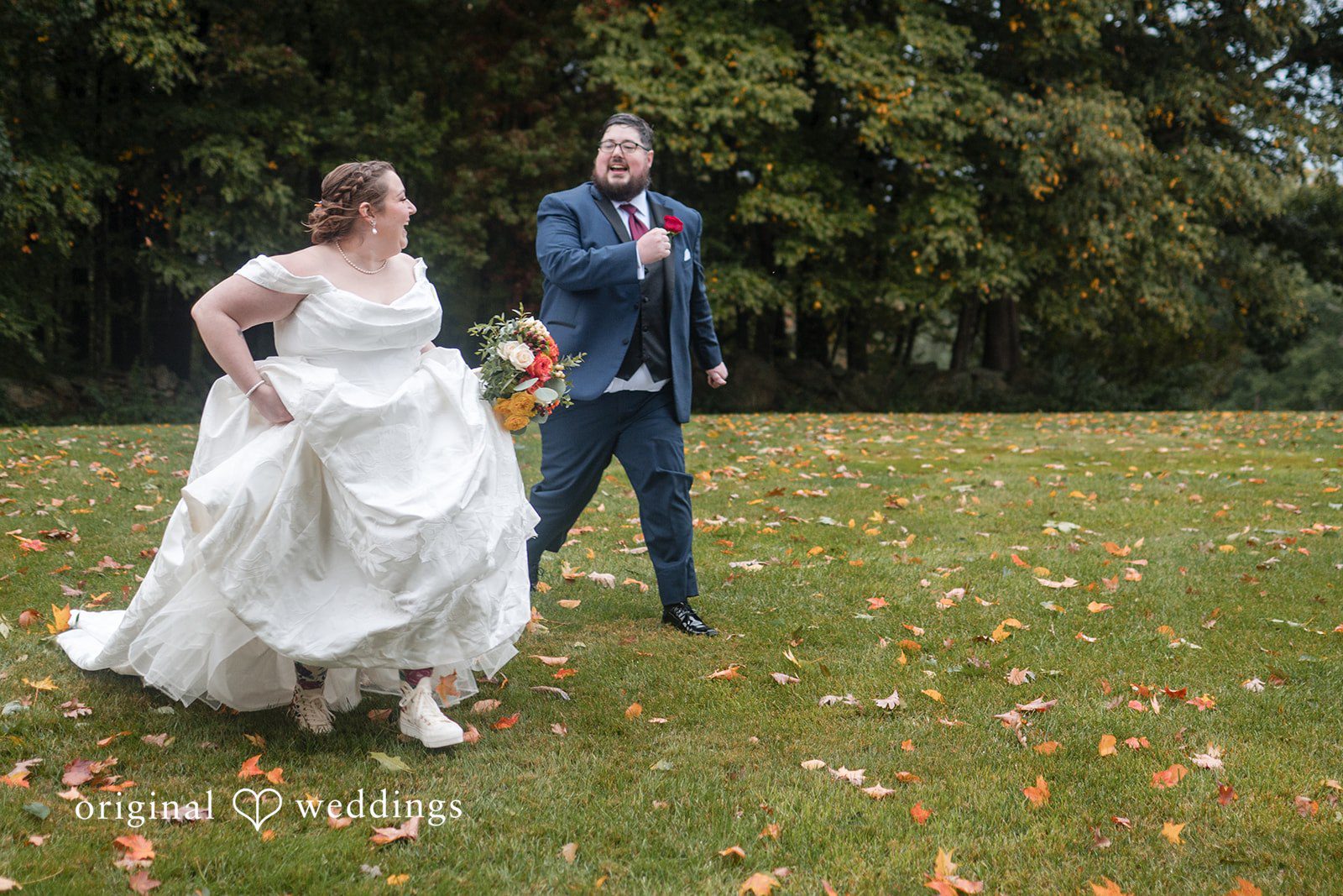 Marian lifting her gown as she walks across the lawn