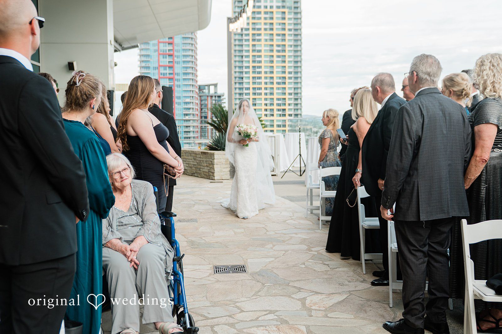Bride walking down the rooftop aisle