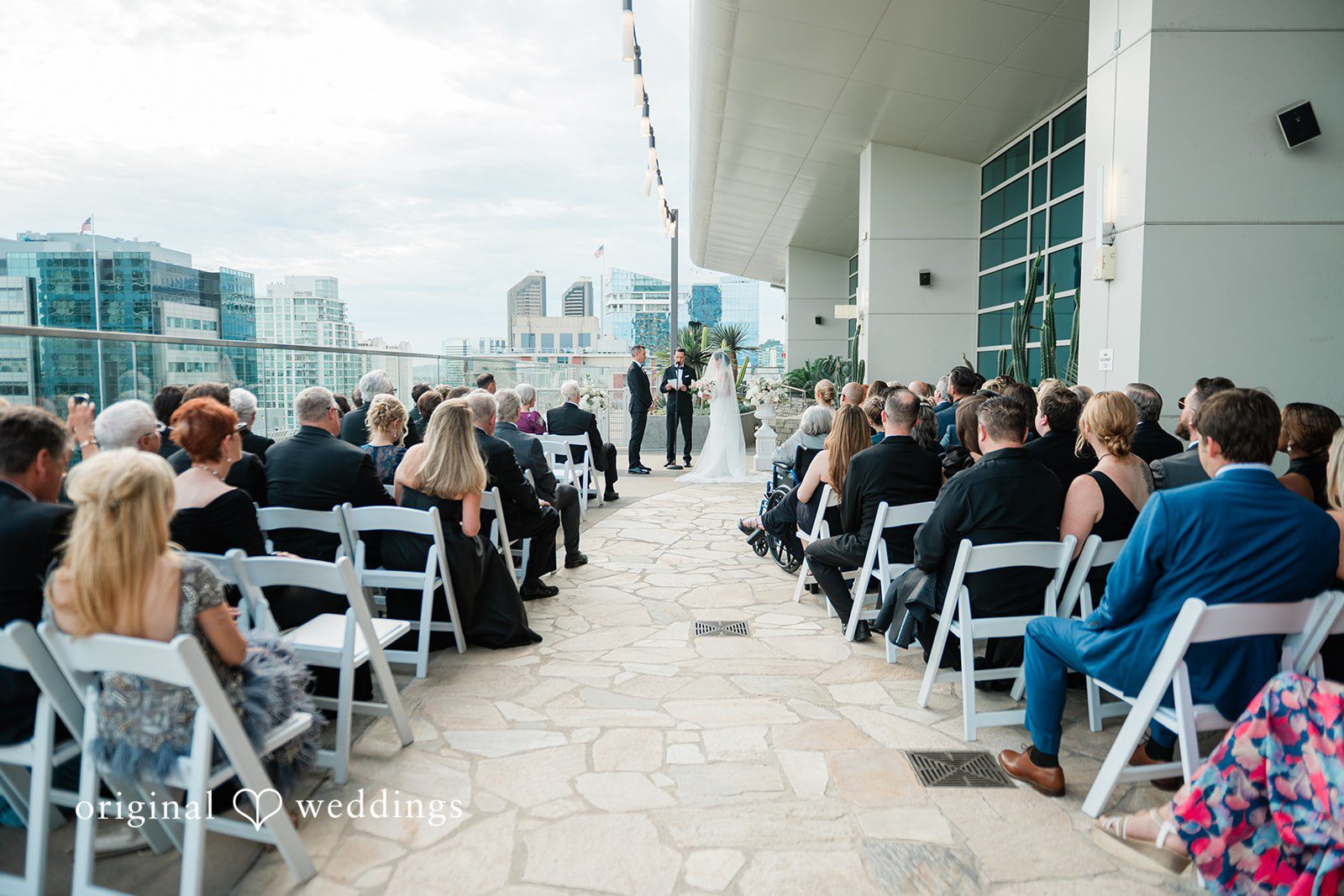 Guests seated along the rooftop aisle