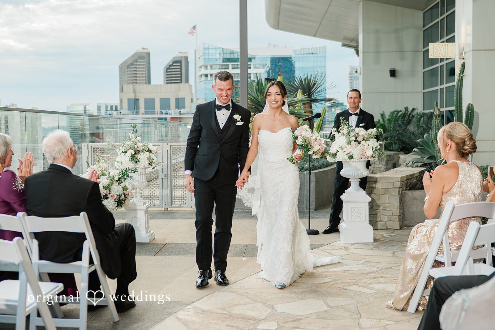 Rooftop ceremony with guests watching